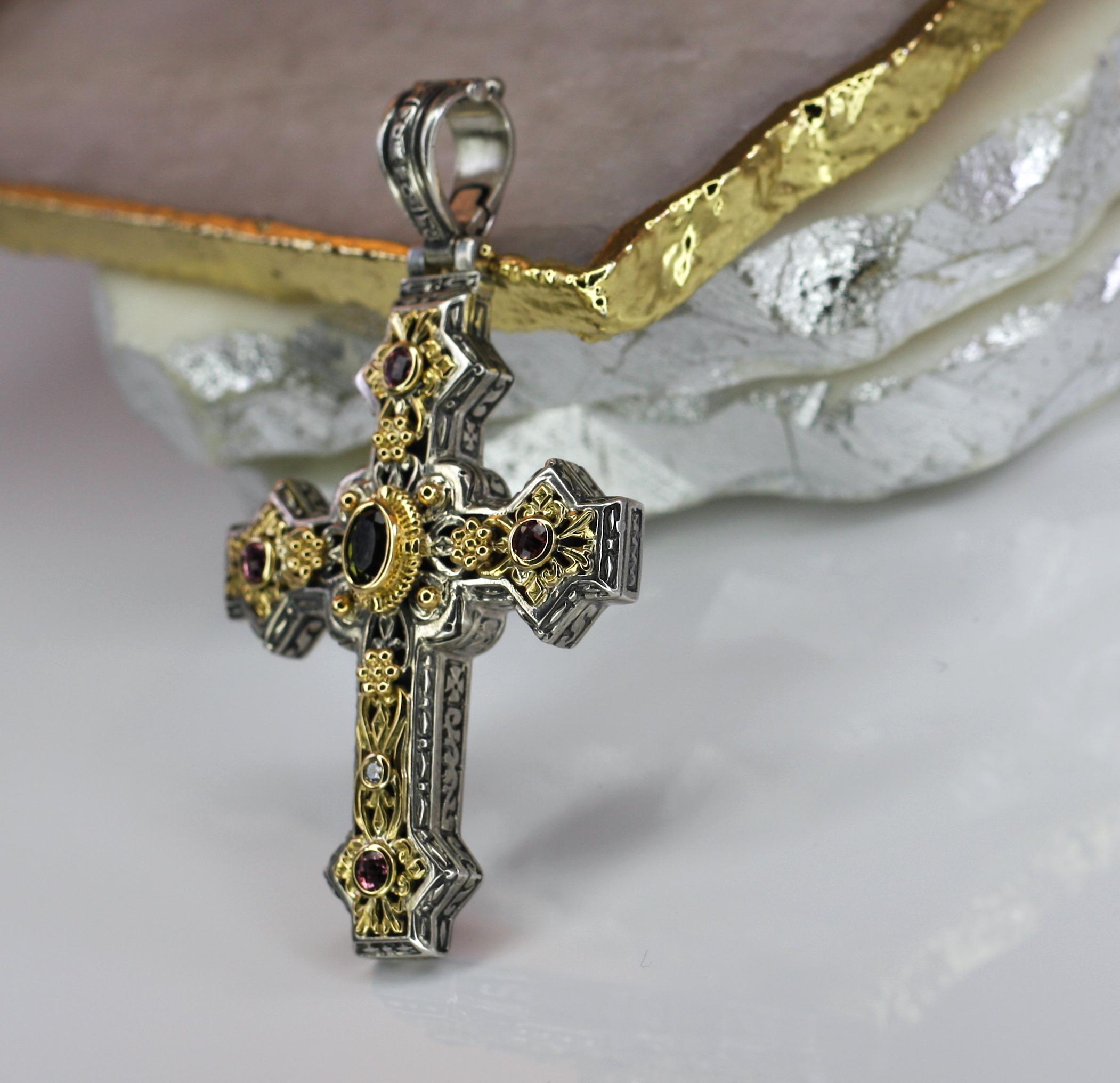 This S.Georgios designer cross pendant is all handmade and decorated with granulation work from sterling silver and solid 18 Karat yellow gold to create a stunning unique look. This gorgeous enhancer features pink and green Tourmalines total weight