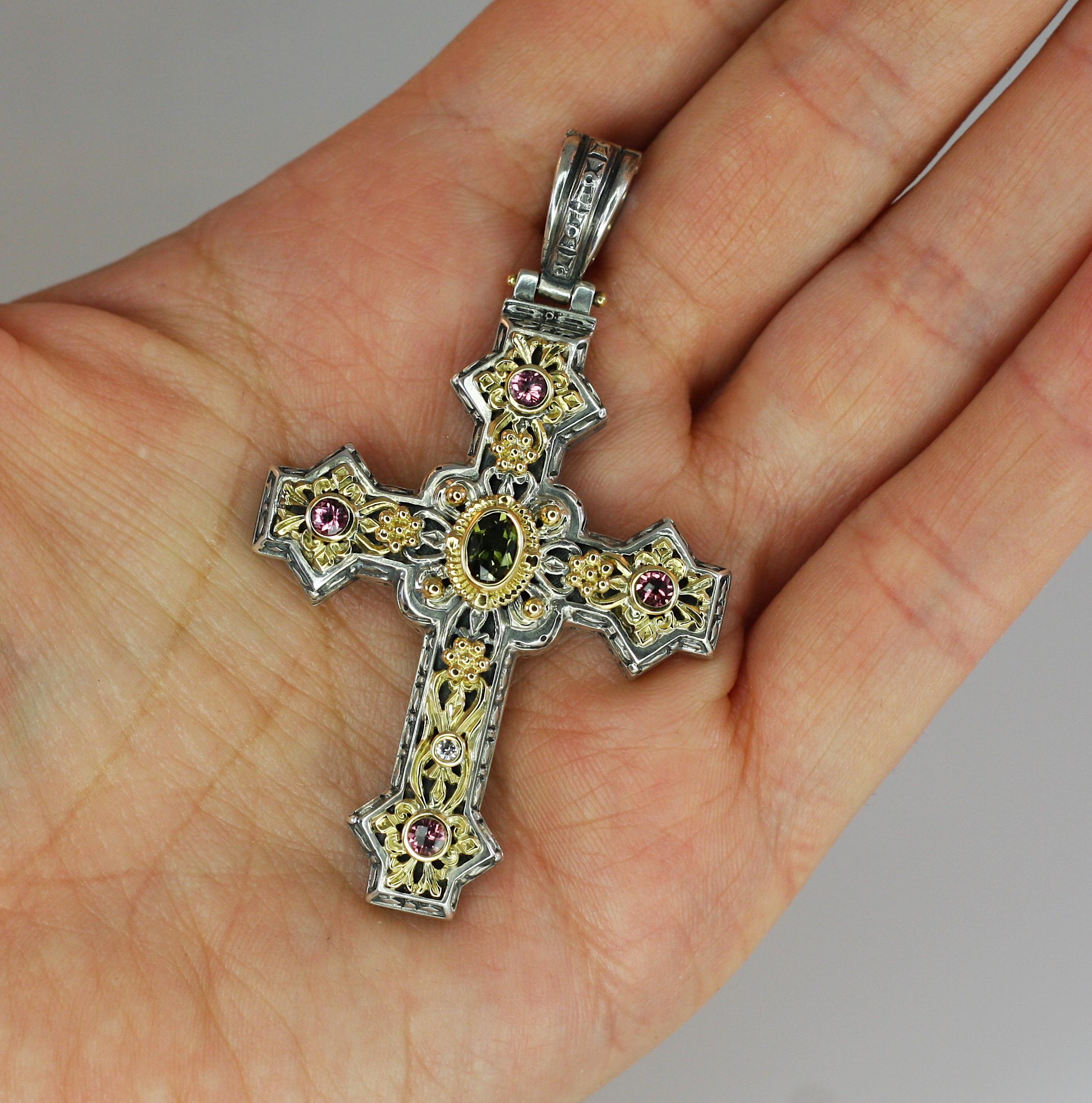 Presenting all handmade heavy decorated Cross pendant crafted from sterling silver and solid 18 Karat yellow gold to create a unique look. This enhancer features 1.60 Carat pink and green Tourmalines and 0.04 Carat Diamond. Cross has a hook that