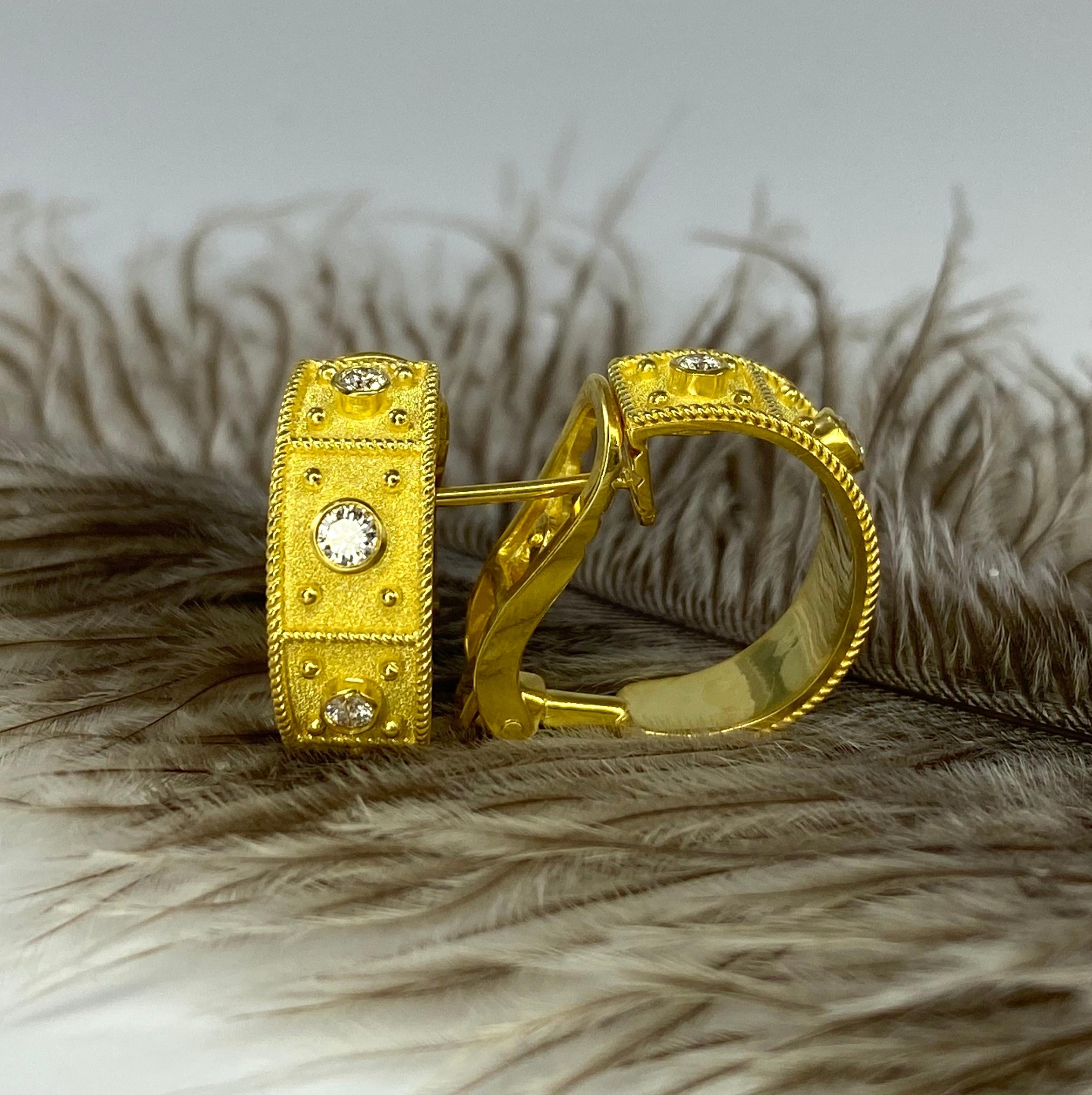 S.Georgios designer earrings are custom crafted from 18 Karat yellow gold and decorated in Byzantine style with granulation work and velvet background and featuring 0.46 carat brilliant cut white diamonds. These gorgeous pierced and clip earrings