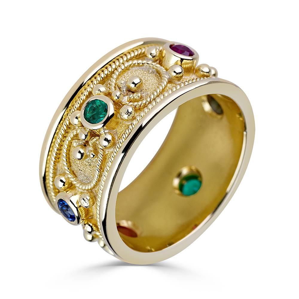S.Georgios design ring handmade from solid 18 Karat Yellow Gold. The ring is microscopically decorated - granulation work - all the way around with gold beads and wires shaped as the last letter of Greek Alphabet - Omega, which symbolizes eternal