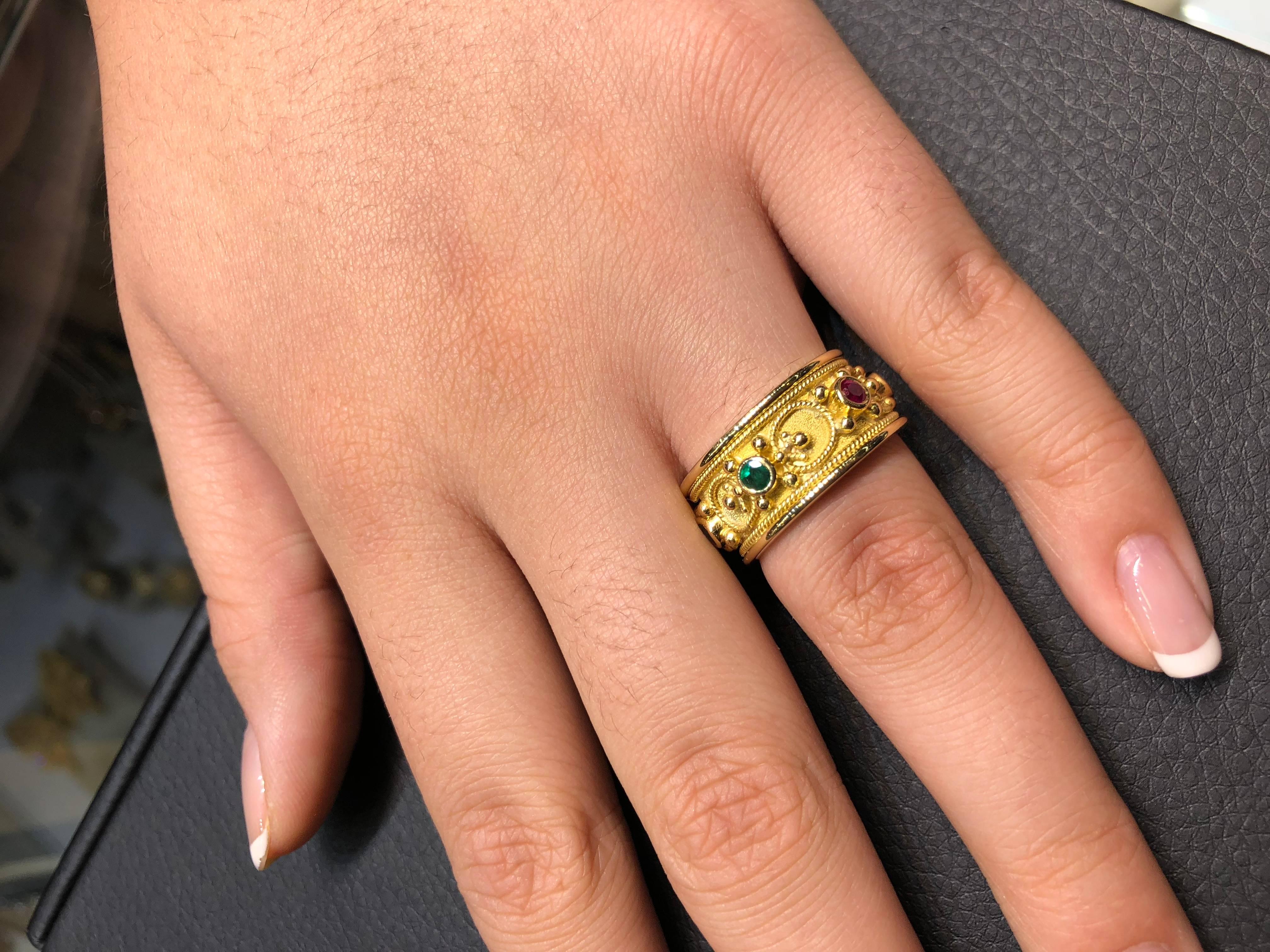 S.Georgios design ring handmade from solid 18 Karat Yellow Gold. The ring is microscopically decorated - granulation work - all the way around with gold beads and wires shaped as the last letter of Greek Alphabet - Omega, which symbolizes eternal