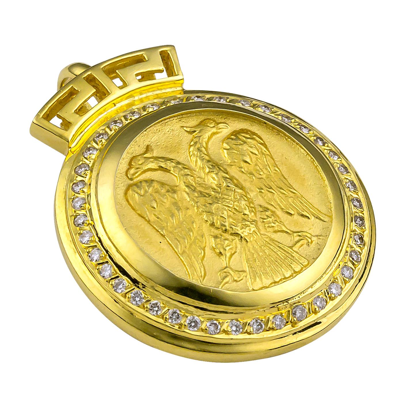 S.Georgios designer 18 Karat Yellow Gold Double-Headed Eagle Diamond Coin Pendant is all handmade and feature Brilliant cut Diamonds around the coin total weight of 0,48 Carats. On the top of the bezel, we have set the Greek Design symbol to give it