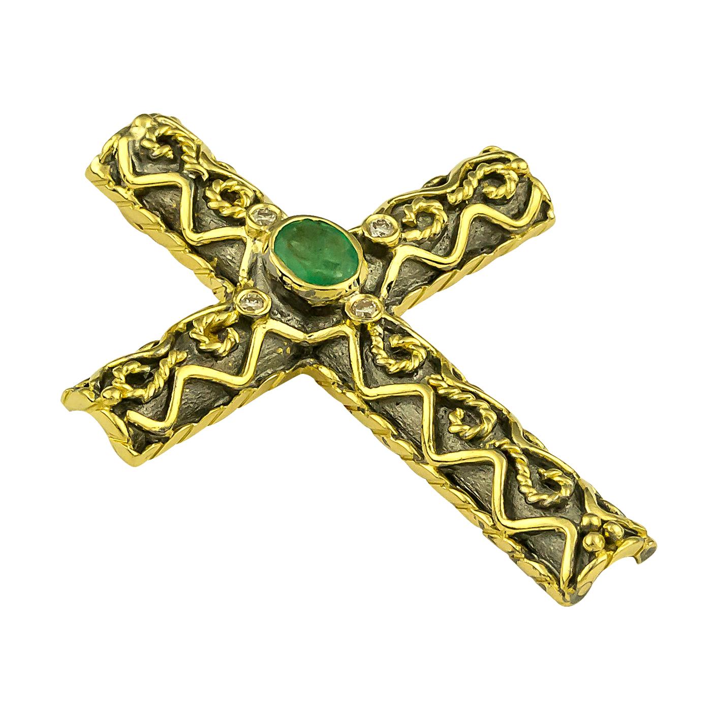 S.Georgios Designer Byzantine Style Cross is handmade from solid 18 Karat Yellow Gold and features an oval shape, Emerald, the weight of 0,35 Carat, and four (4) White Diamonds total weight of 0,06 Carat. This art piece is made with granulation work