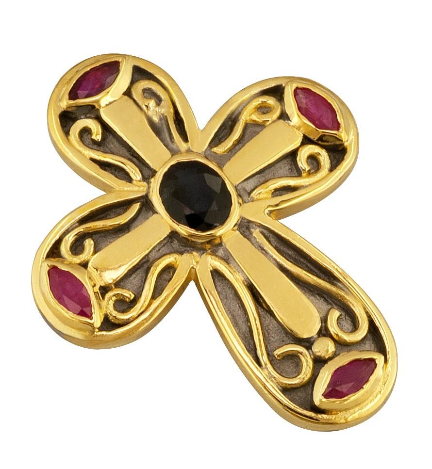 This S.Georgios designer Byzantine Style Cross is handmade from solid 18 Karat Yellow Gold. This beautiful piece features an oval cut sapphire and four marquise cut rubies all the weight of 0,90 Carat. This elegant cross has granulation work all