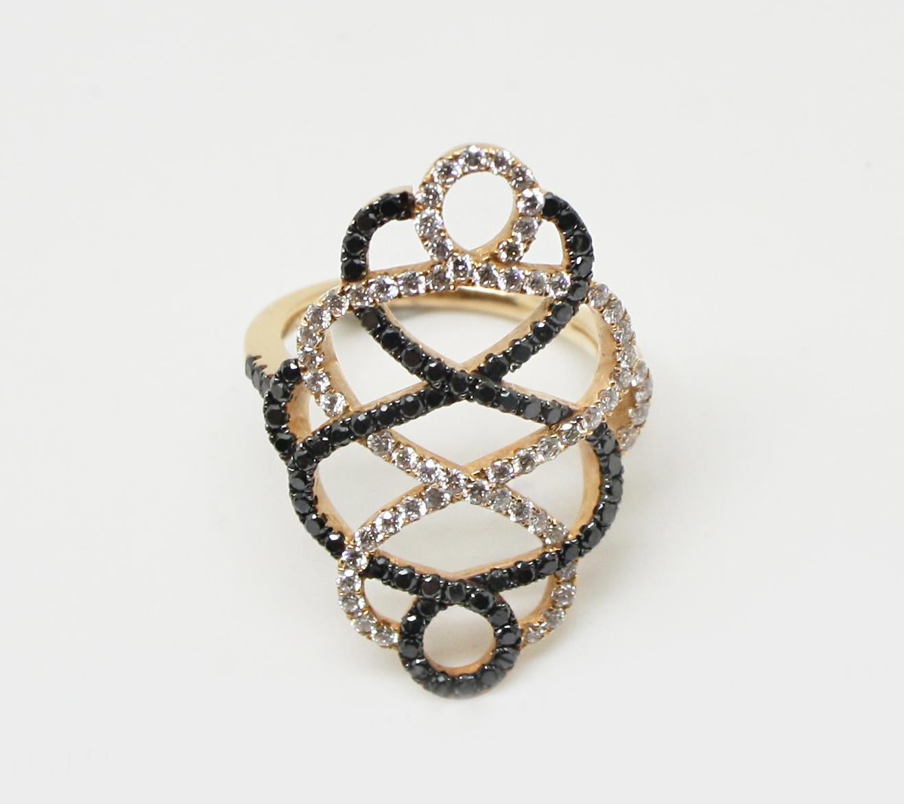 S.Georgios designer 18 Karat Rose Gold Black Rhodium White and Black Diamond Ring is all handmade in a unique Spiral design. The gorgeous ring features brilliant cut white diamonds total weight of 0.67 Carat and black diamonds total weight of 0.68