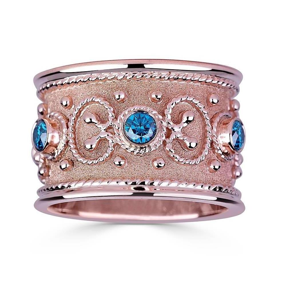 S.Georgios Special Edition Hand Made 18 Karat Rose Gold Eternity Band Ring with 0.68 Carat total weight of Blue Diamonds. This gorgeous ring is microscopically decorated all the way around with gold beads and wires - granulation - shaped like the