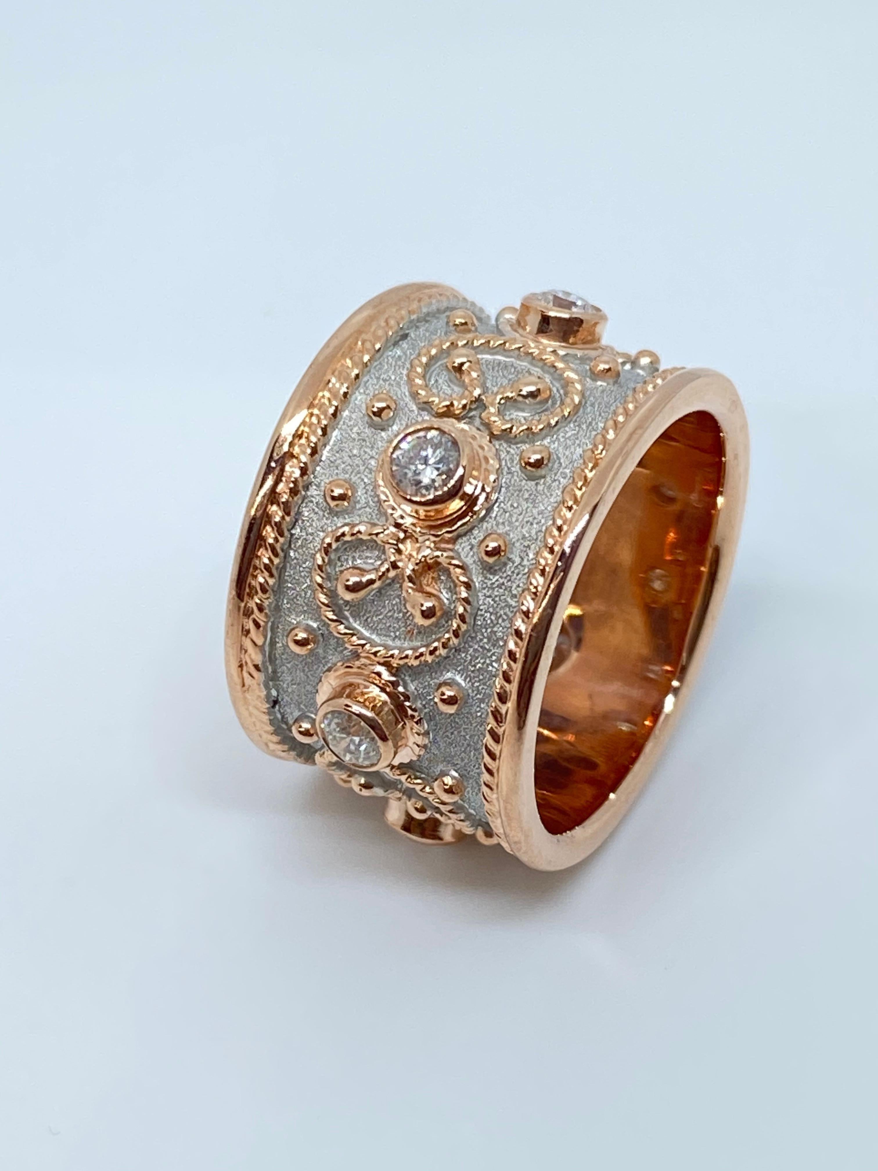 S.Georgios designer Diamond Two-Tone Band Ring is handmade from solid 18 Karat Rose Gold. The beautiful Rose Gold Band ring is microscopically decorated all the way around with Rose Gold bead granulation the shape of the Greek letter- Omega which