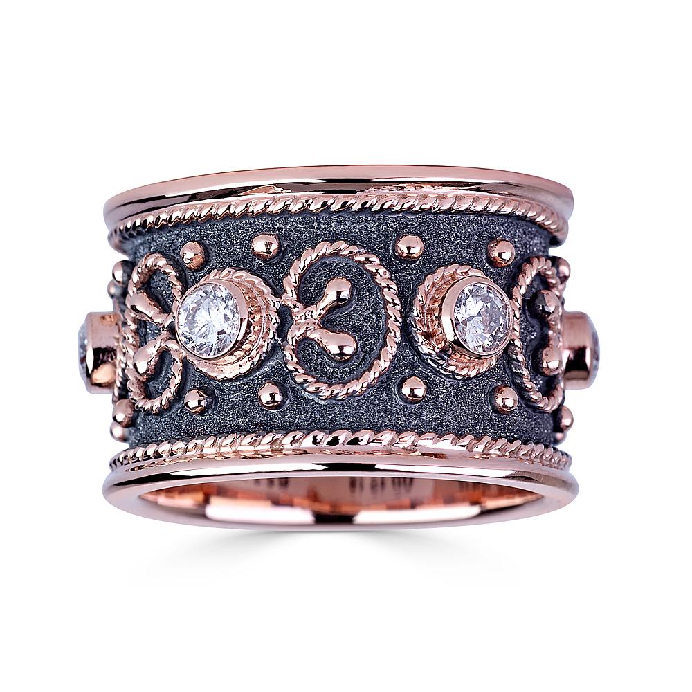 S.Georgios designer ring is all handmade from solid 18 Karat Rose Goldnad custom-made. The beautiful ring is microscopically decorated all the way around with Rose Gold beads and wires shaped like the last letter of the Greek Alphabet - Omega, which