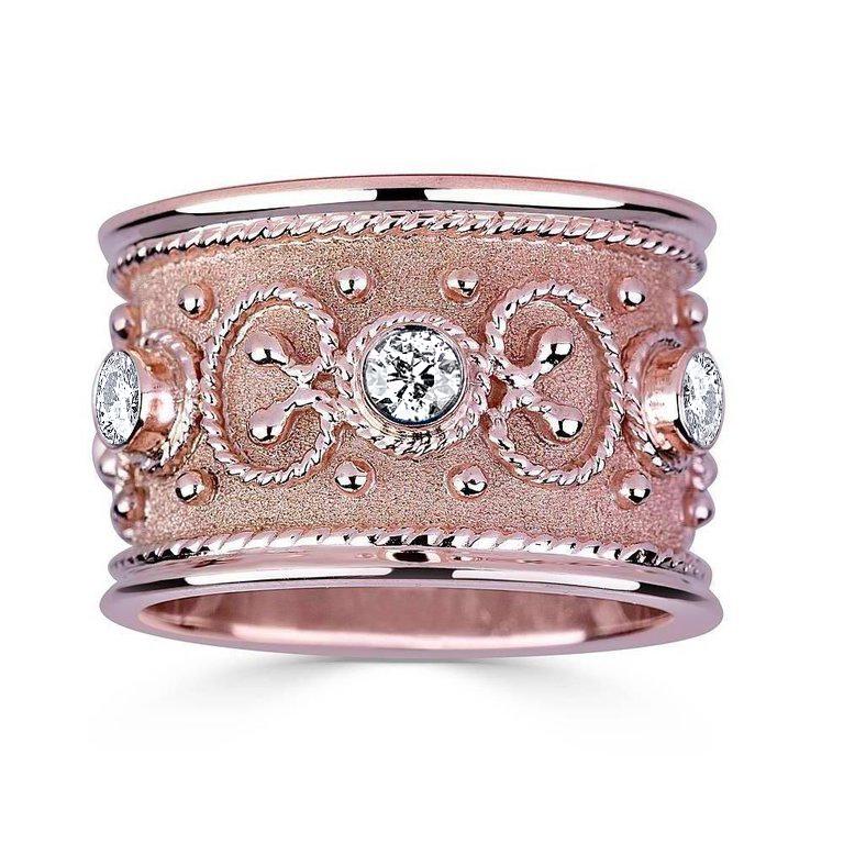S.Georgios designer Ring is all handmade from solid 18 Karat Rose Gold and custom-made. The stunning ring is microscopically decorated all the way around with gold beads and wires shaped like the last letter of the Greek Alphabet - Omega, which