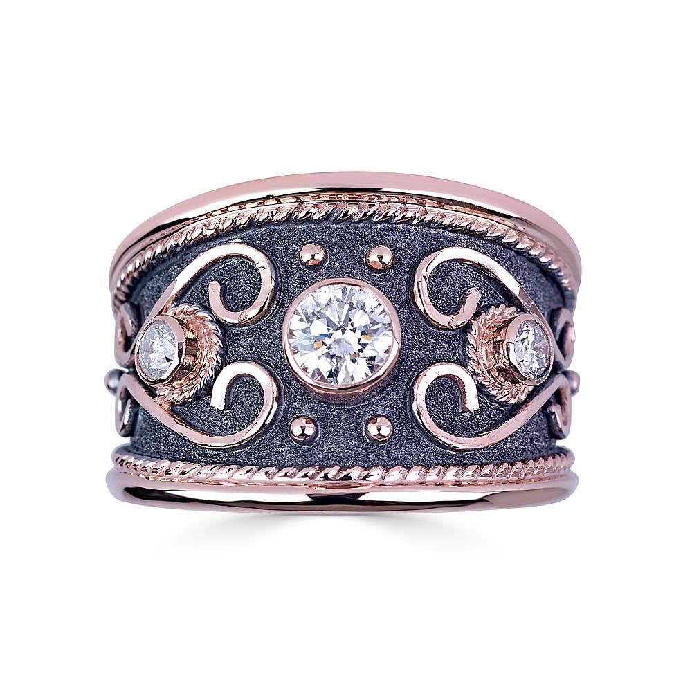 Unique S.Georgios designer 18 Karat Solid Rose Gold Ring all handmade with Byzantine style granulation and a unique velvet look on the background finished in Black Rhodium. The ring features a Brilliant cut Center 0.44 Carat White Diamond and 2 side