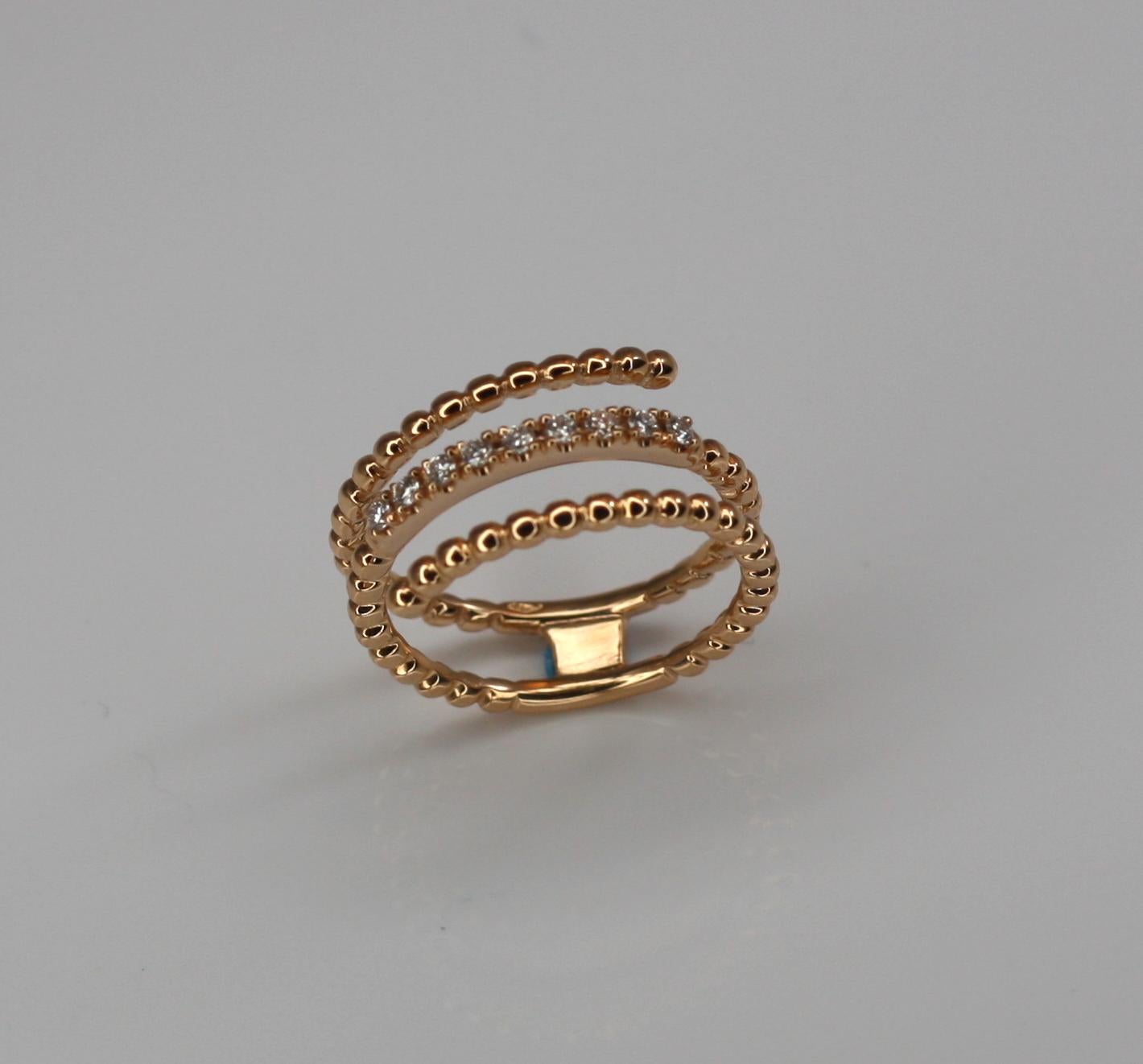 S.Georgios designer 18 Karat Rose Gold Band Ring all hand made. This beautiful and simple to wear triple-band ring has a layer of white brilliant cut diamonds on the middle layer total weight of 0.15 Carat and can be ordered also in Yellow and White