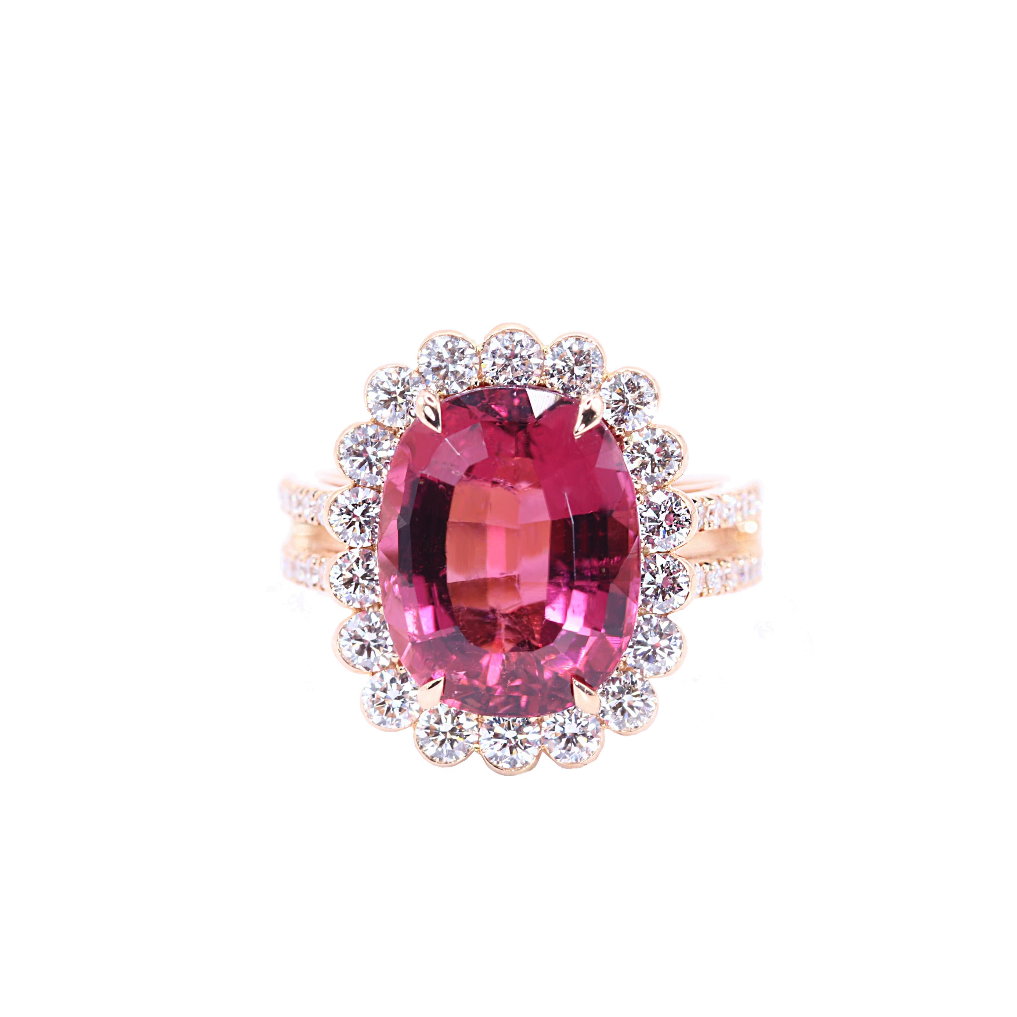 S.Georgios designer presents a stunning 18K Rose Gold Ring featuring a large oval-cut Pink Tourmaline total weight of 7.68 Carats, elegantly surrounded by brilliant-cut Diamonds in a floral design. The band is adorned with two lines of additional