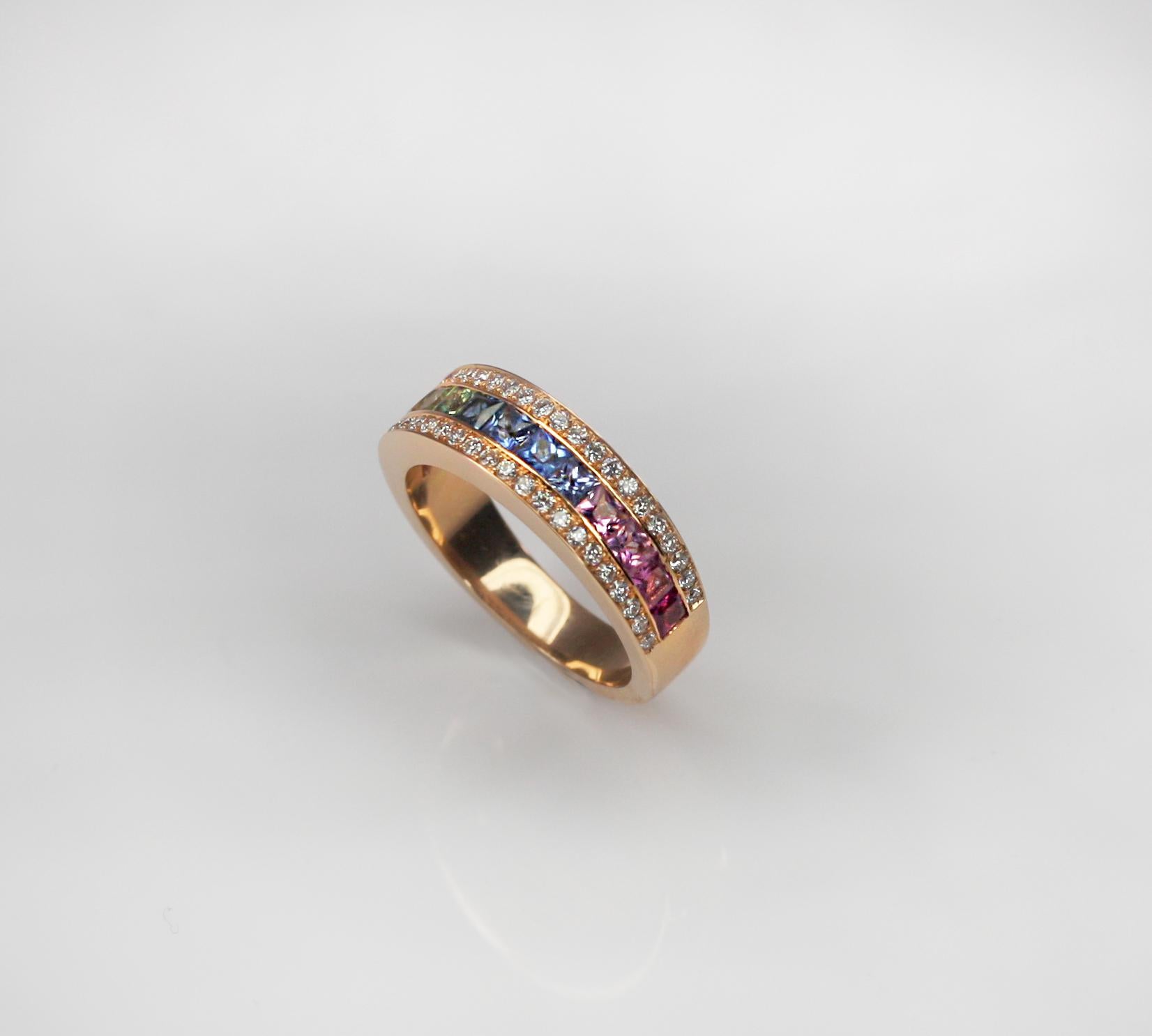 This S. Georgios designer Multicolor Band Ring in Rose Gold 18 Karat is all hand made with microscopic channel settings. This gorgeous band features princess cut multicolor natural Sapphires total weight 1.55 Carat, surrounded by 2 rows of brilliant
