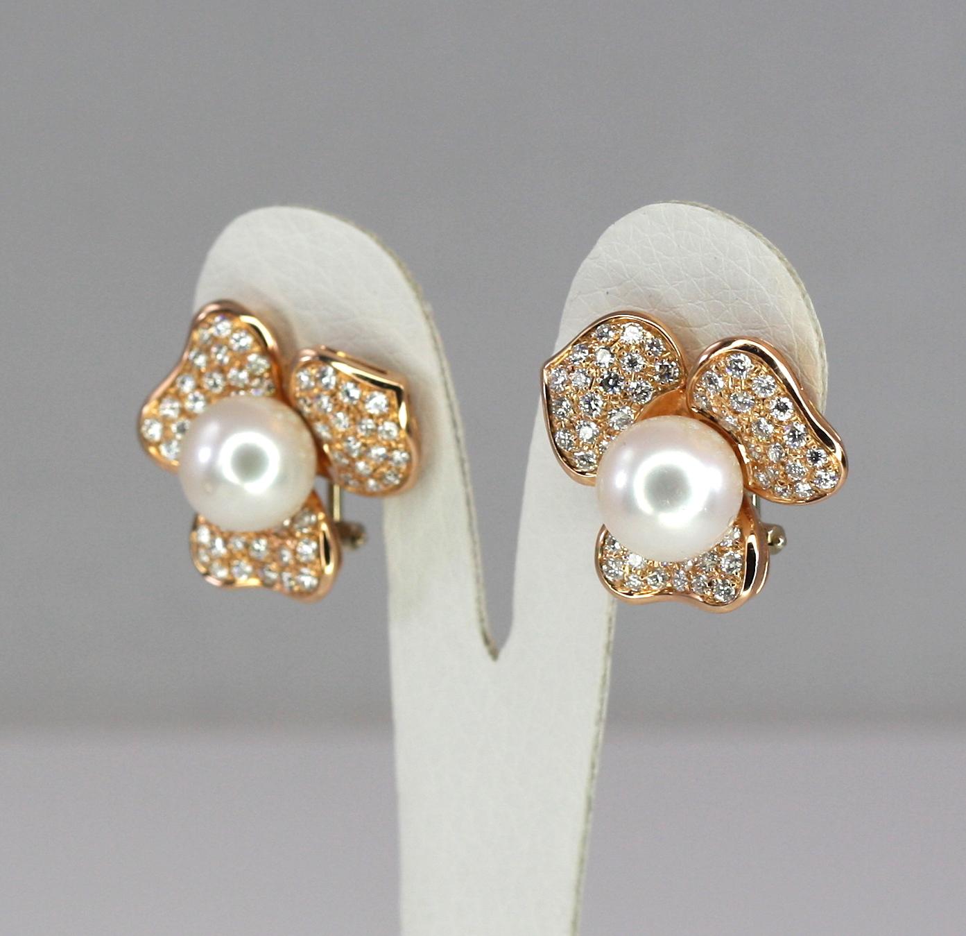 S.Georgios designer earrings custom made Rose gold 18 Karat. This stunning pair features a triple-A South Sea white Pearl 11.0mm in the center and brilliant-cut white diamonds total weight of 2,24 Carat around forming a flower. They are made to be