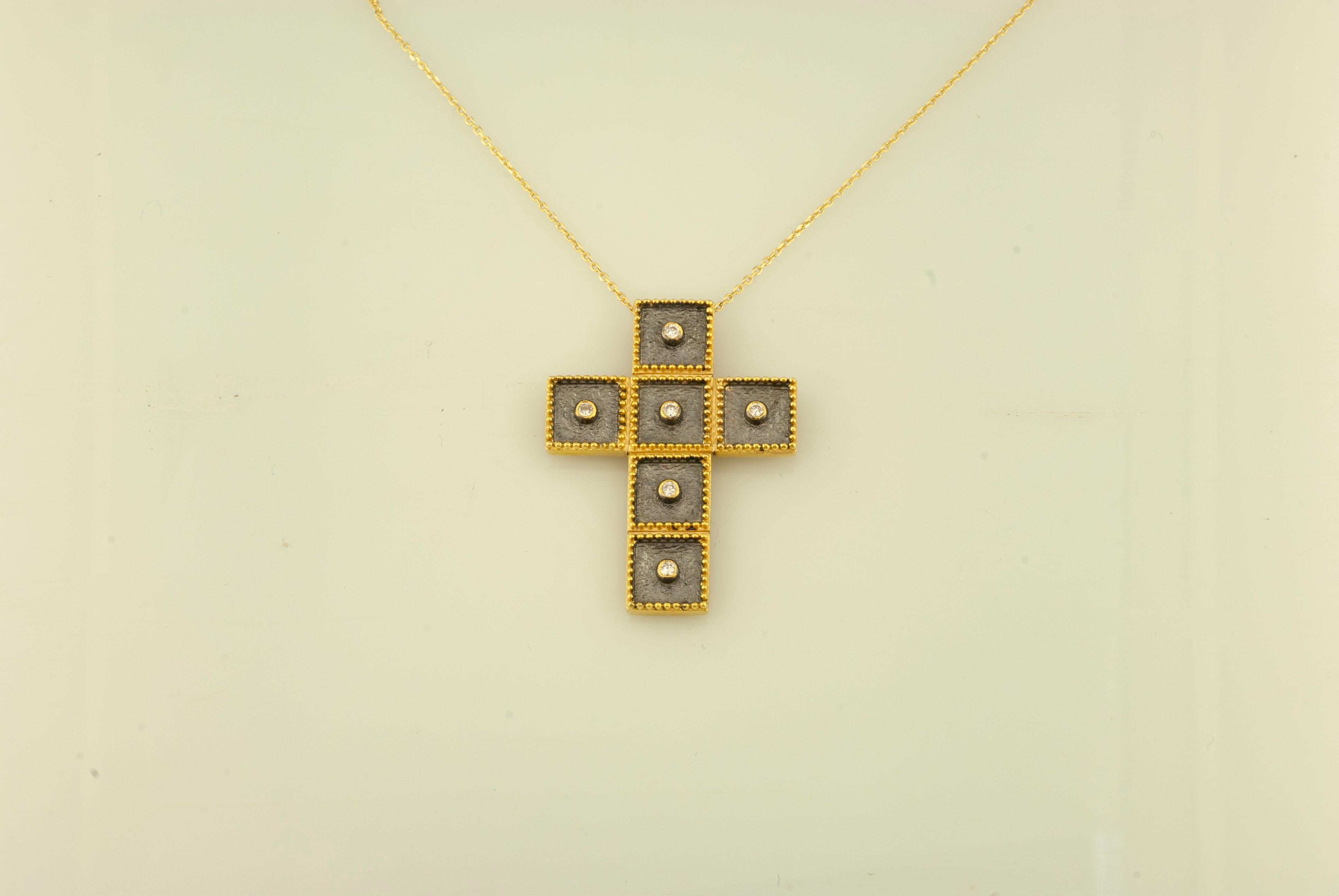 This S.Georgios designer 18 Karat yellow Gold and black Rhodium cross pendant necklace and chain are handmade with microscopically decorated Byzantine-style granulation work and a unique velvet background look. This gorgeous cross is finished with