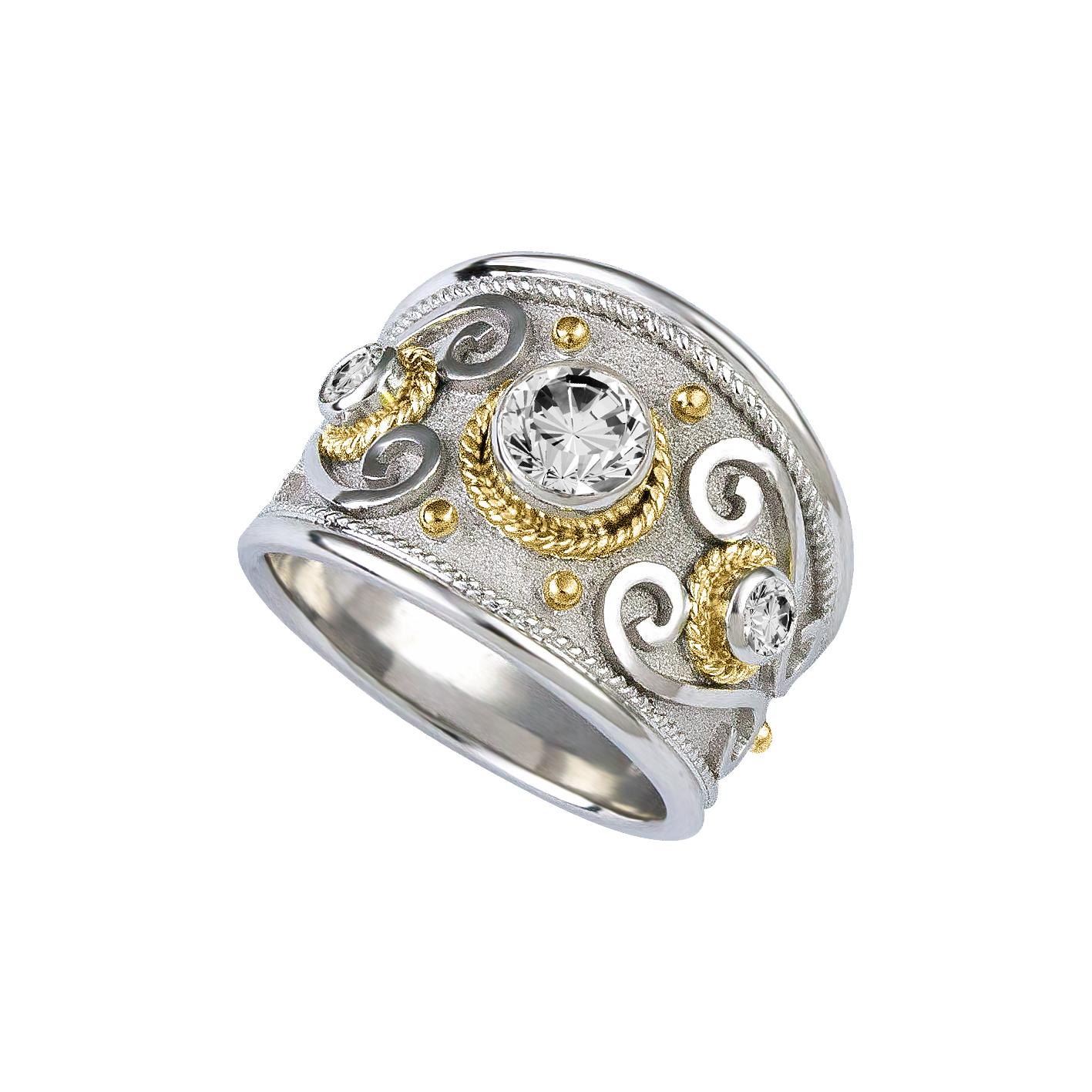 S.Georgios designer Two-Tone 18 Karat solid white gold ring all handmade with Byzantine-style granulation in 18 Karat white and yellow gold and a unique velvet background. This gorgeous ring features 3 Brilliant cut White Diamonds - in the center,