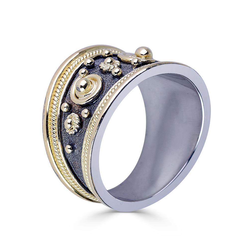 S.Georgios designer graduated band ring all handmade from solid 18 Karat White and Yellow Gold. The ring is in white gold 18 Karat and is microscopically decorated with 18 Karat yellow gold wires. Granulated details contrast with Byzantine velvet