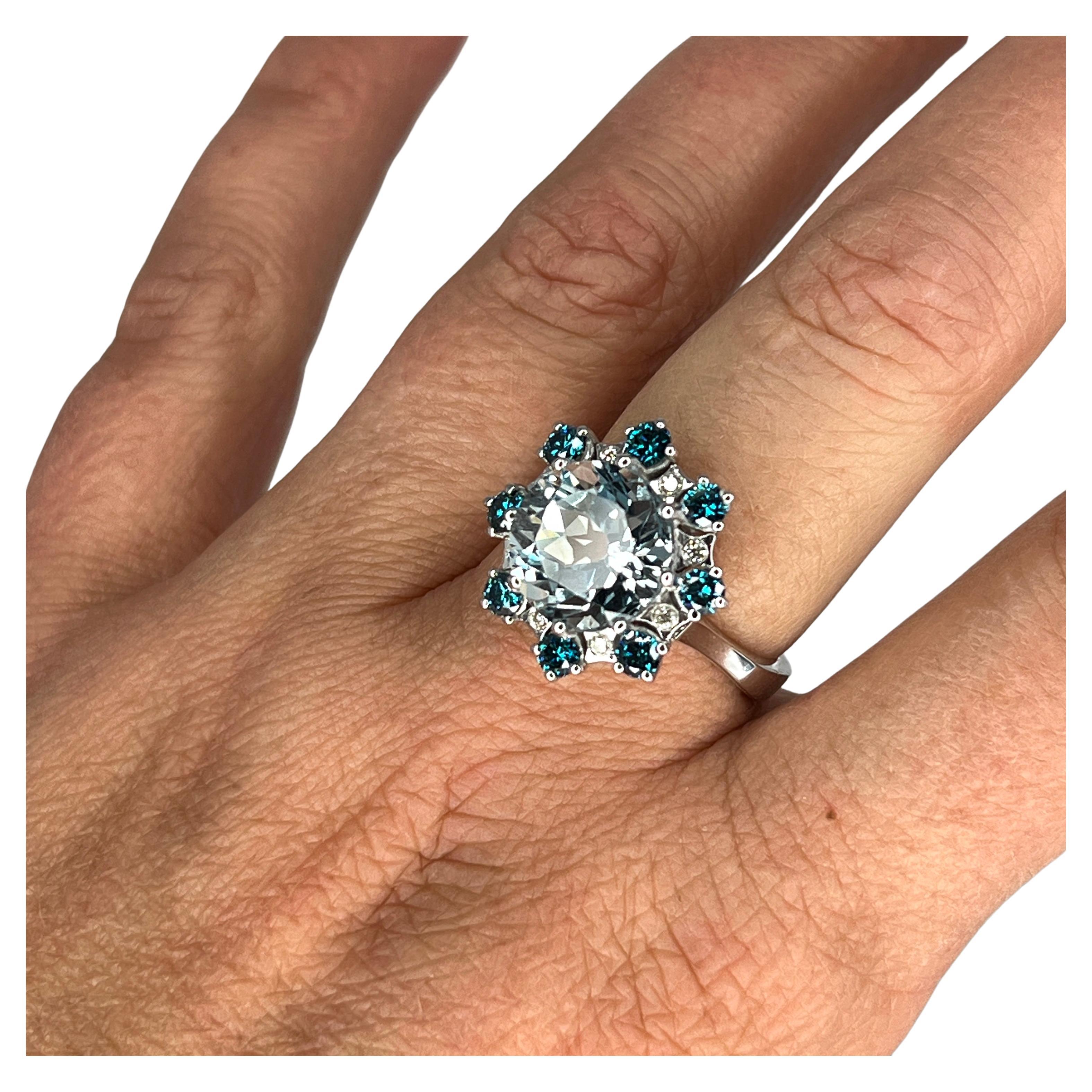 This Engagement ring from S.Georgios designer features 5.17 Carats Aquamarine center complemented by 0.10 Brilliant cut White Diamonds and 0.76 Carat of Brilliant cut Blue Diamonds. It was handmade from 18 Karat White gold in our workshop in Greece.