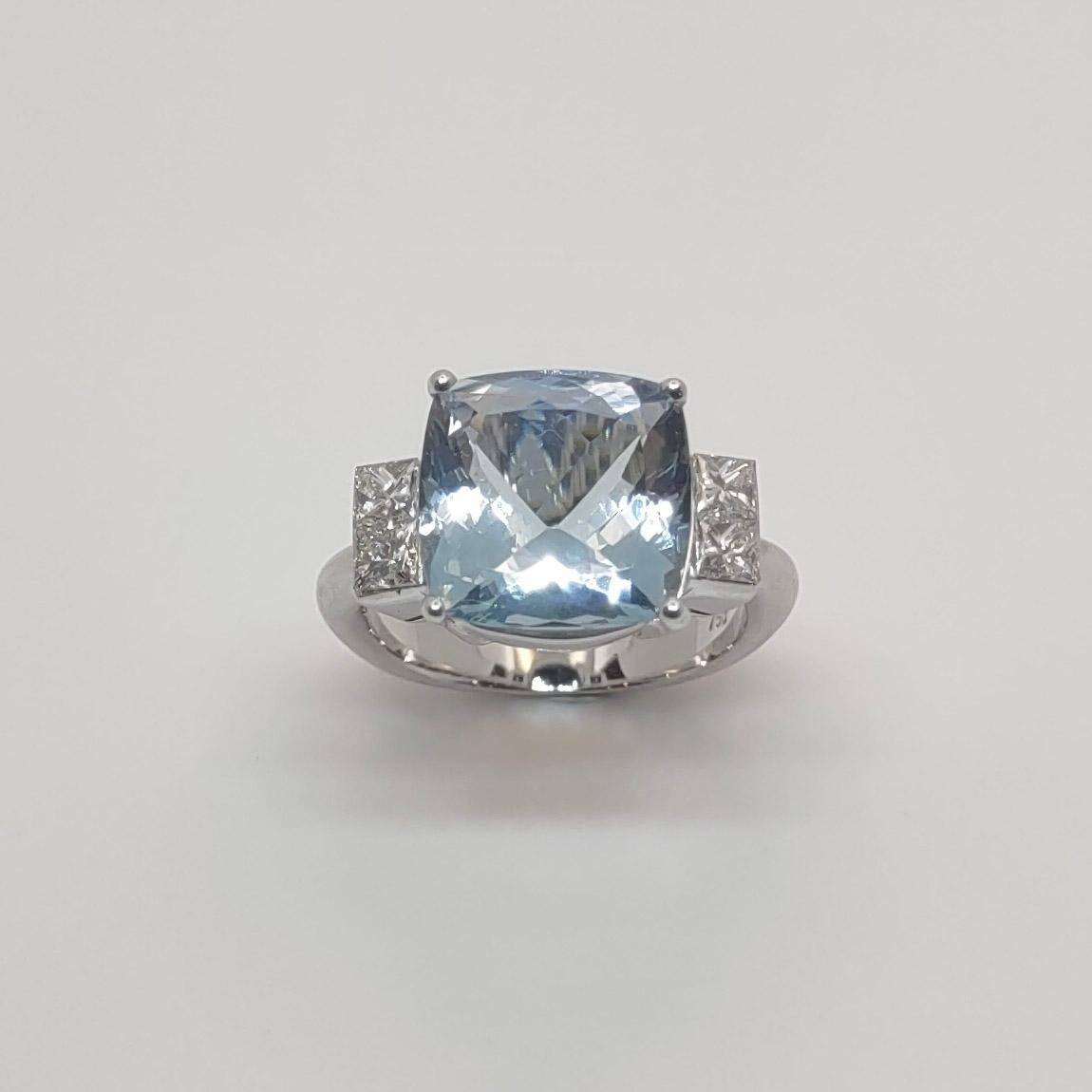 Designer S.Georgios is handmade in 18 Karat White gold and features a solitaire cushion cut Aquamarine of top quality with a weight of  5.06 Carat. On the sides ring features an invissible setting of emerald cut White Diamonds of total weight of