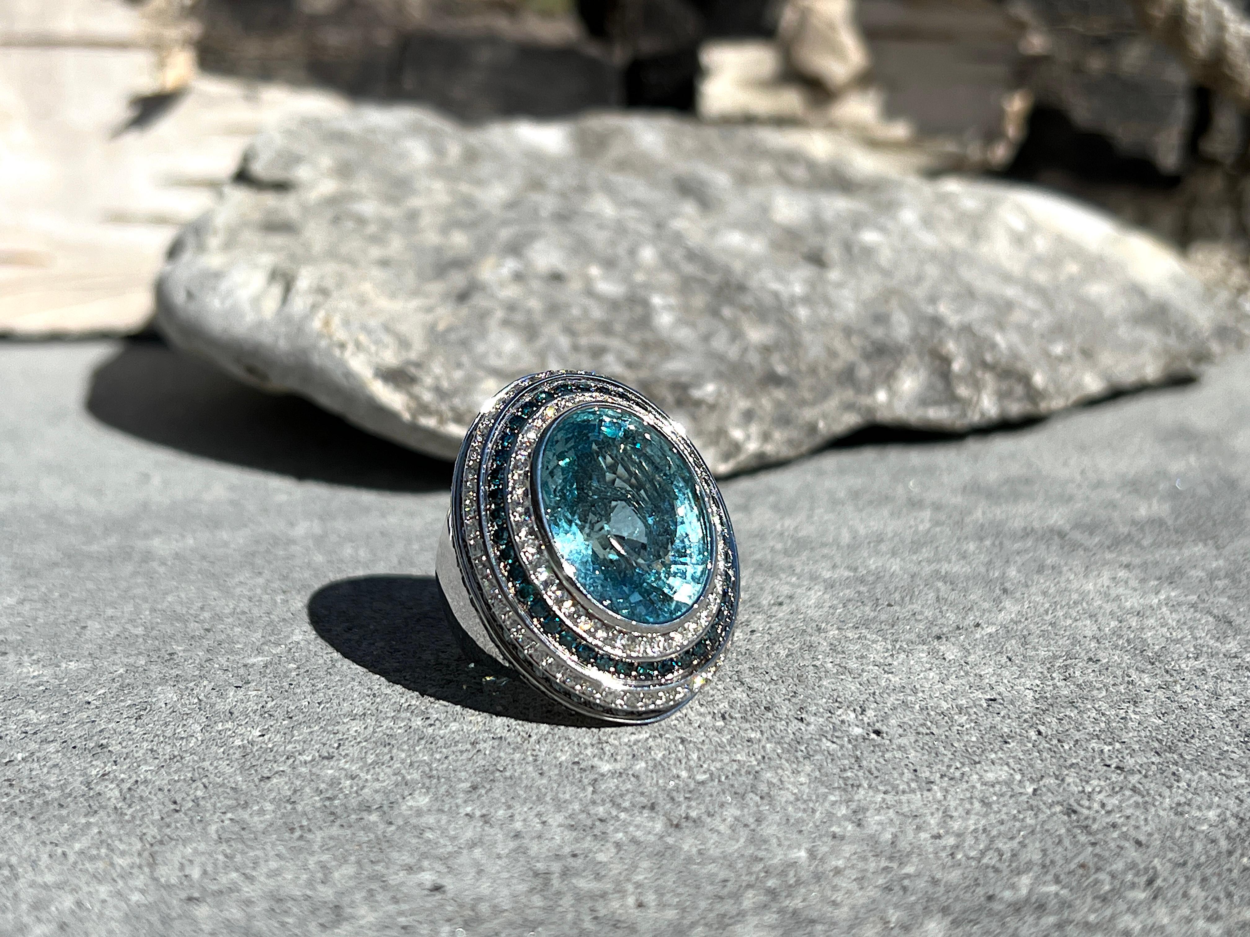 This S. Georgios designer wide dome Ring is made from 18 Karat White Gold and is all hand-made with microscopic settings. The gorgeous ring features 14.47 Carats of natural radiant cut Aquamarine in gorgeous color, 1.72 Carats of brilliant cut Blue