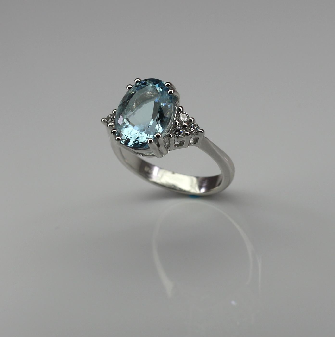 This S.Georgios designer White Gold 18 Karat Ring features a gorgeous Oval shape Aquamarine with a weight of 4.94 Carat. and six (6) Brilliant-cut White Diamonds VS1 -F Color total weight of 0.22 Carat. This stunning classic and super elegant ring