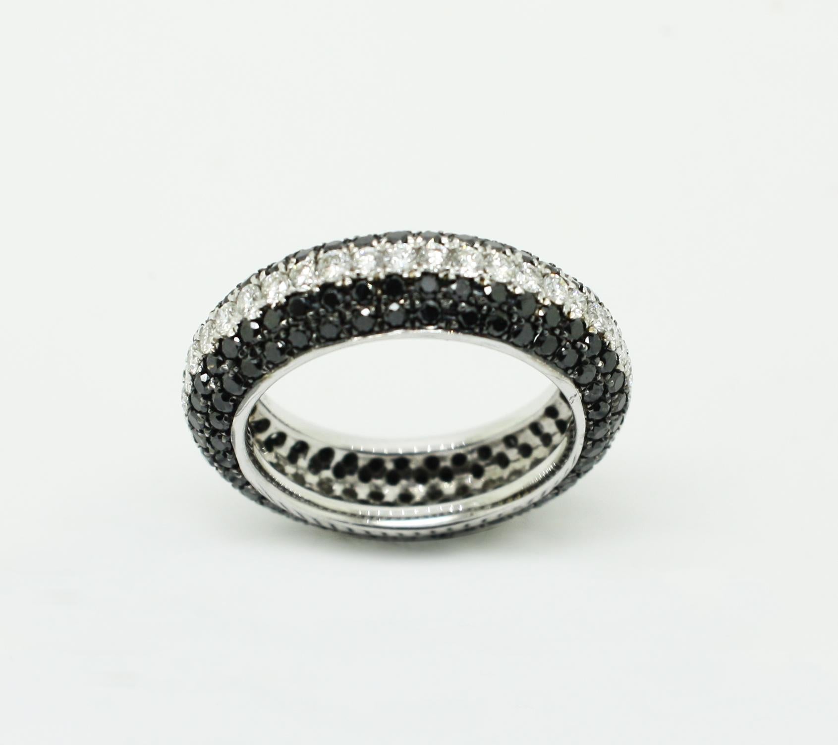 S.Georgios designer 18 Karat White Gold Band with White and Black Diamond Ring is all handmade in a unique two-tone look. The gorgeous band features brilliant cut white diamonds total weight of 0.78 Carat, and black diamonds total weight of 1.10