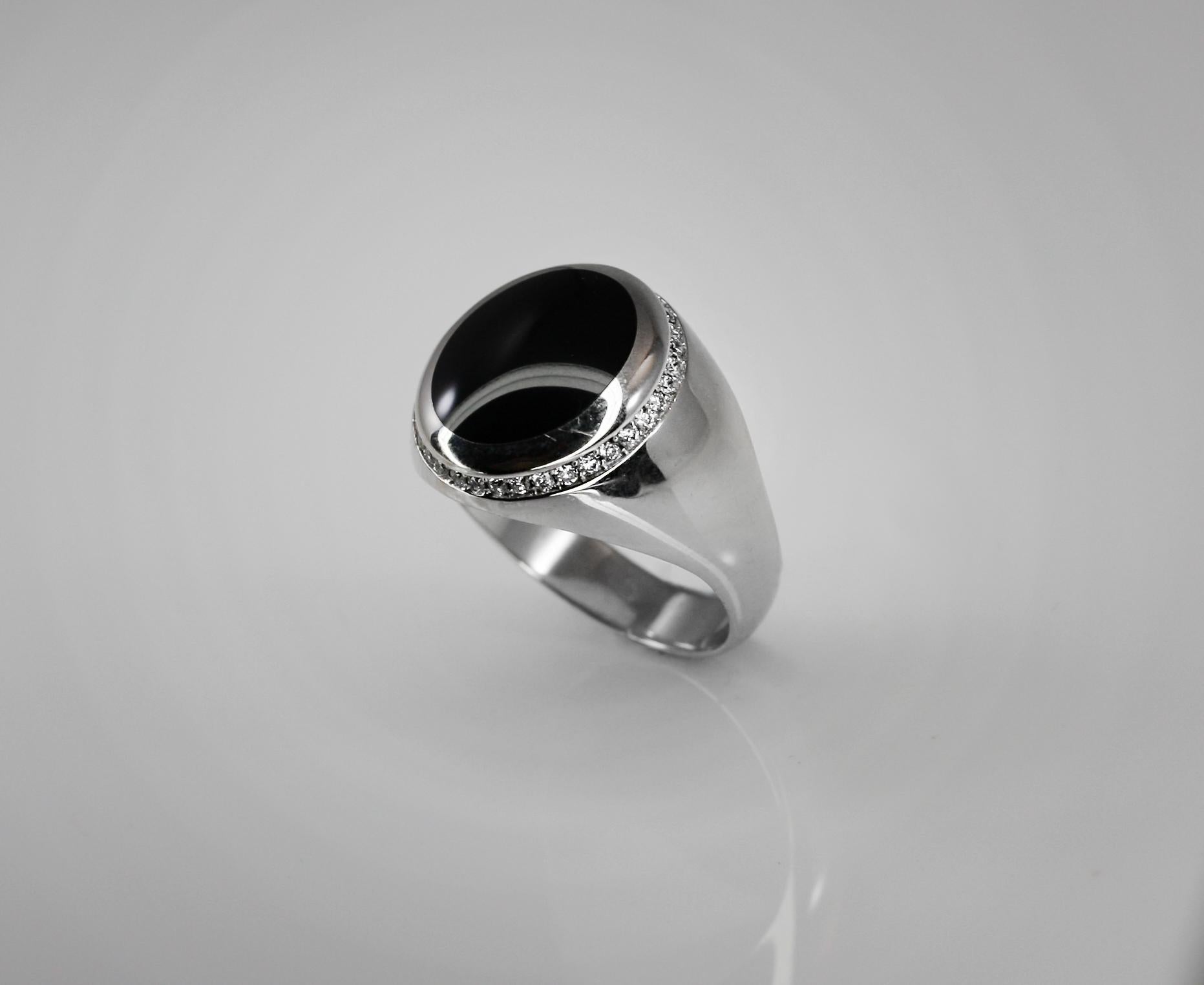 S.Georgios designer Men's Ring in White Gold 18 Karat is all hand-made and features a stunning natural Black Onyx surrounded by a bezel of White Diamonds with a total weight of 0.35 Carat. This is a gorgeous and classic ring for every day and can be