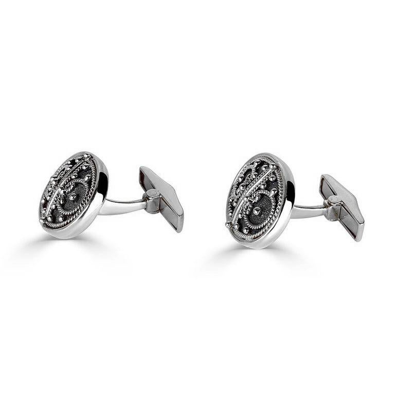 S.Georgios designer cufflinks handmade in 18 Karat white gold and Black Rhodium. Cufflinks are microscopically decorated with granulation work in Byzantine style and with a unique velvet background. Also, the mechanism on the back is solid 18 Karat