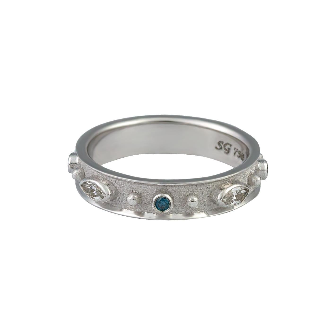 S.Georgios design ring handmade from solid 18 Karat White Gold all custom-made. The beautiful ring is microscopically decorated all around with white gold beads and 4 Marquise-cut white diamonds total weight of 0.38 Carat and 4 Brilliant cut blue