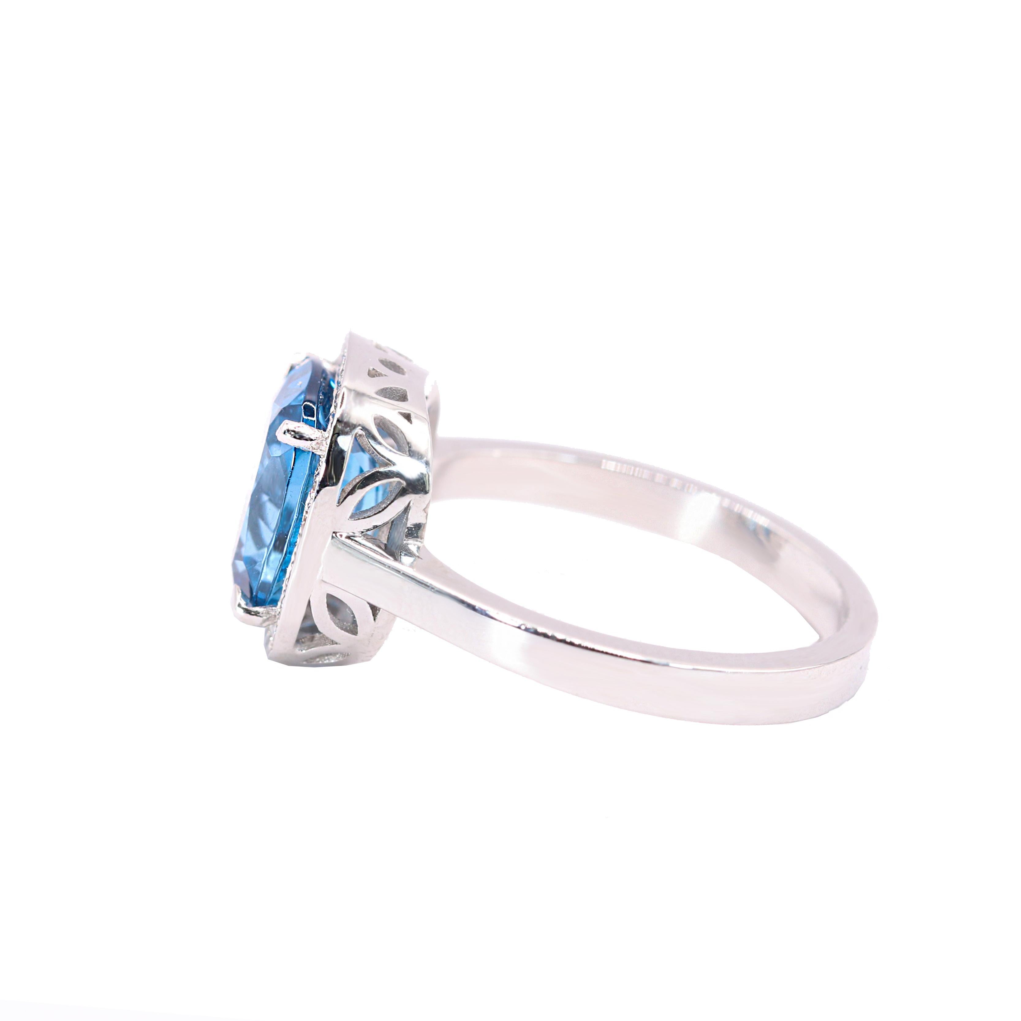 Contemporary Georgios Collections 18 Karat White Gold Blue Topaz Ring with Diamond Bezel For Sale