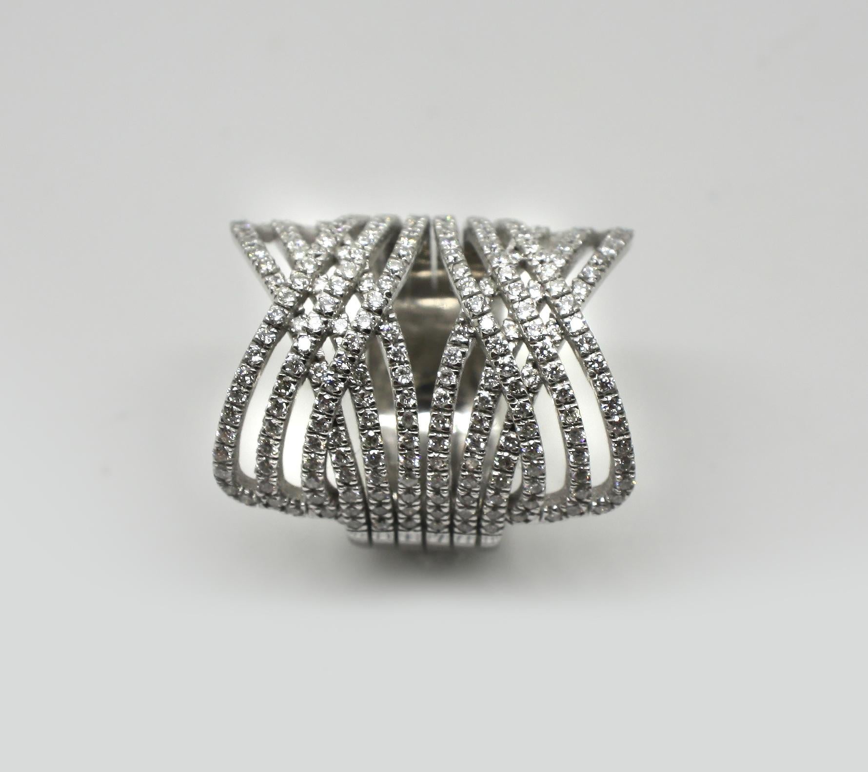 S.Georgios designer 18 Karat White Gold Brilliant Cut White Diamond wide band Ring is all handmade in a unique three-row hug and kisses design. The gorgeous ring features brilliant cut white diamonds total weight of 2.04 Carat and is set