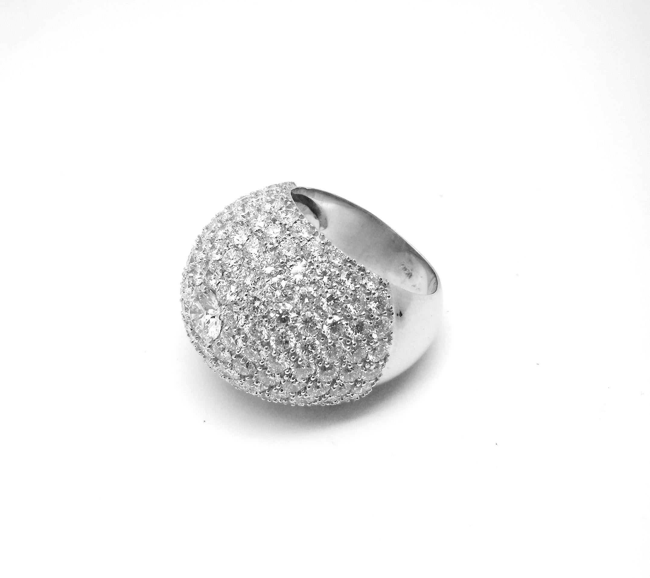 S.Georgios designer 18 Karat White Gold pave Brilliant Cut White Diamond Wide Dome Ring is all handmade in a unique dome design. The gorgeous ring features a central brilliant-cut white diamond VS2 Color G total weight of 0.56 Carat and