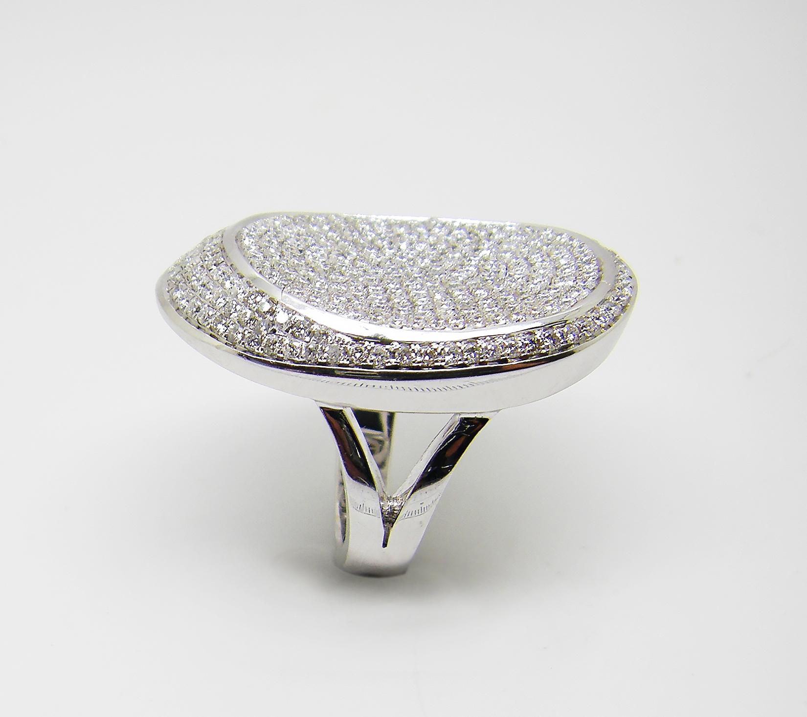 S.Georgios designer 18 Karat White Gold Brilliant Cut Pave Diamond Ring is all handmade in a unique design. The gorgeous ring features brilliant cut white diamonds total weight of 2.22 Carat and is set microscopically. We also make this beautiful