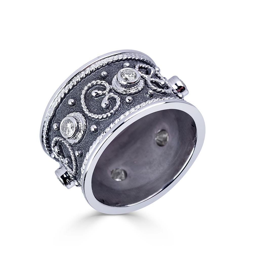 S.Georgios designer ring is all handmade from solid 18 Karat White Gold and custom-made. The beautiful ring is microscopically decorated all the way around with gold beads and wires shaped like the last letter of the Greek Alphabet - Omega, which