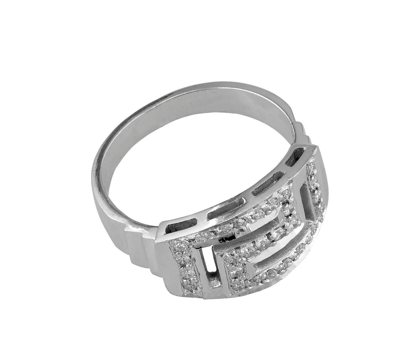 Bague en or blanc 18 carats du designer S.Georgios, présentant le motif de la clé grecque symbolisant l'éternité. Cette magnifique bague comporte 27 diamants blancs taille brillant d'un poids total de 0,36 carat. La qualité des pierres et du travail