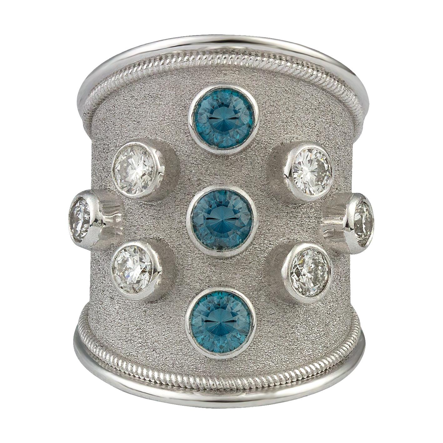 S.Georgios designer Hand Made 18 Karat White Gold Ring all custom made with granulation work and twisted wire on the sides. It features 6 (six) Brilliant-cut White Diamonds total weight of 1.12 Carats and 3 (three) Brilliant cut Blue Diamonds total