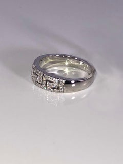 Anello Georgios Collections in oro bianco 18 carati con diamante e design a chiave greca