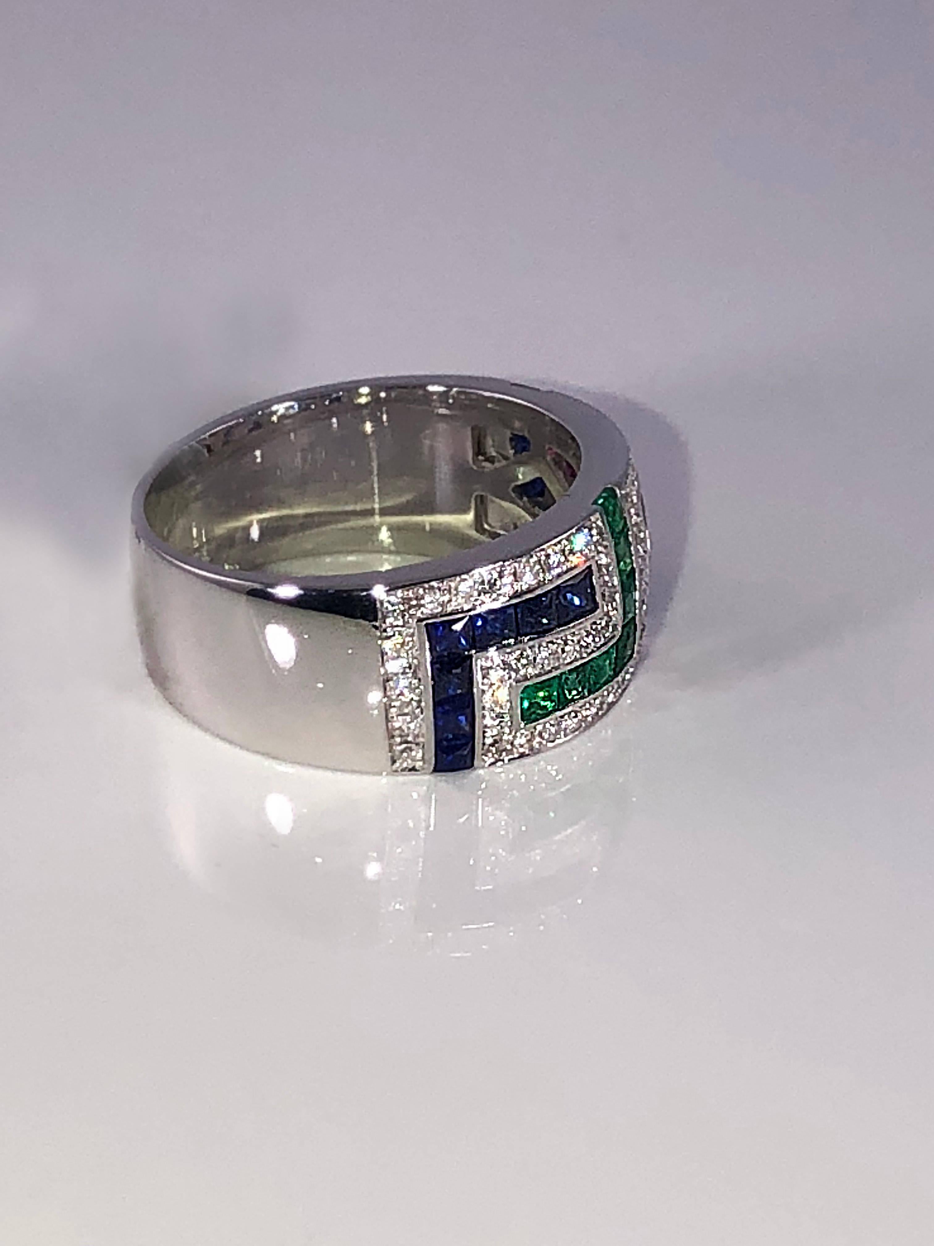 S.Georgios designer 18 Karat White Gold band Ring featuring the Greek Key design symbolizing eternity. It has Brilliant Cut White Diamonds total weight of 0.50 Carat, Princess cut Rubies, Sapphires and Emeralds total weight of 1.52 Carat. The