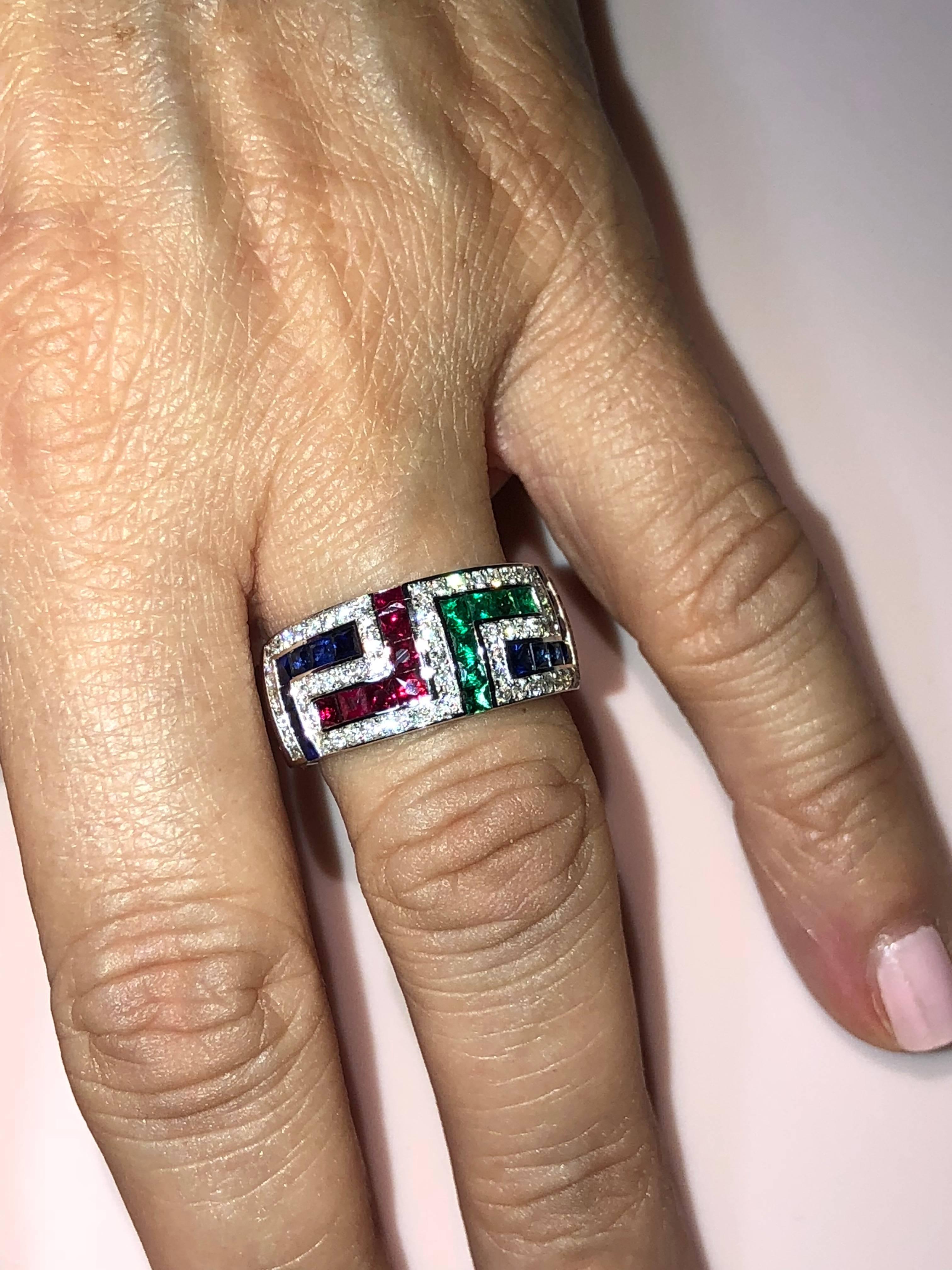 S.Georgios designer 18 Karat White Gold Ring featuring the Greek Key design symbolizing eternity. It has Brilliant Cut White Diamonds total weight of 0.50 Carat, Princess cut Rubies, Sapphires and Emeralds total weight of 1.52 Carat. The quality of