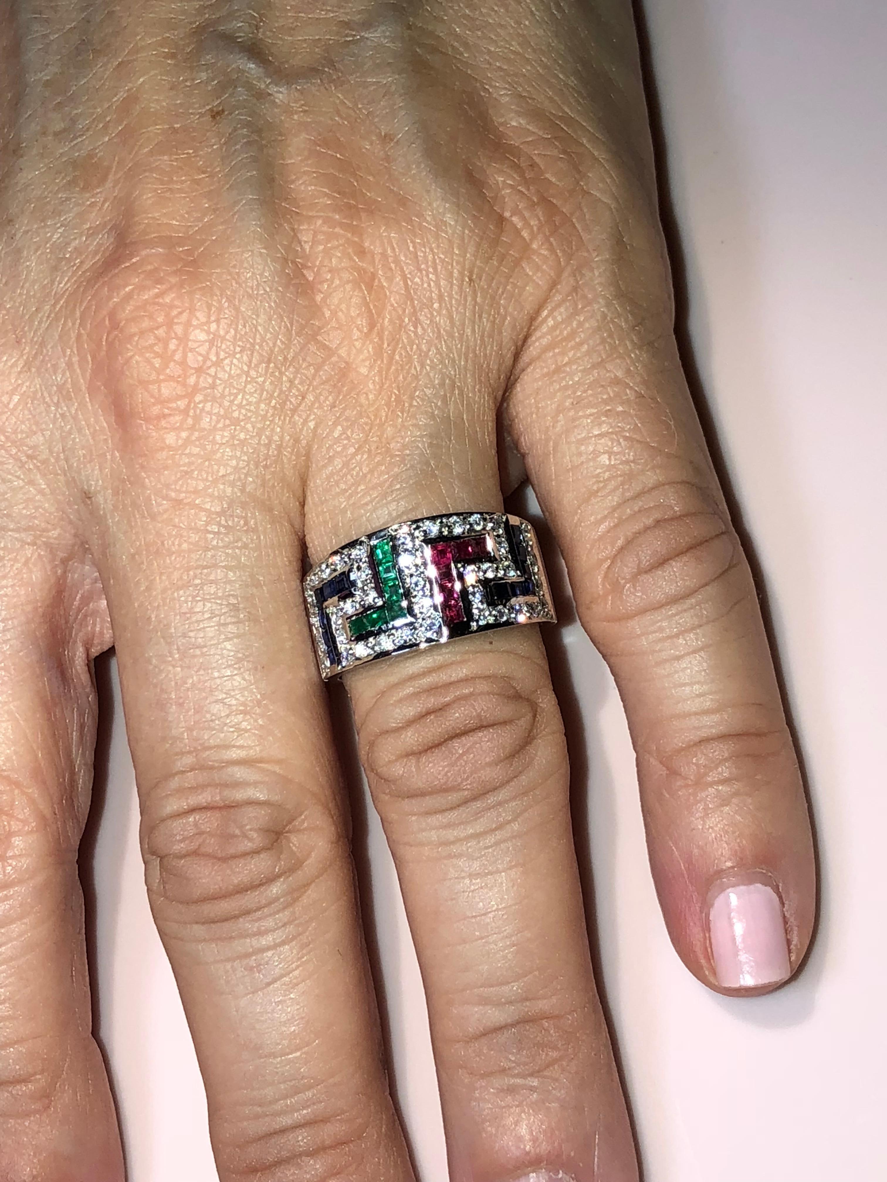 S.Georgios designer 18 Karat White Gold Ring featuring the Greek Key design symbolizing eternity. It has Brilliant Cut White Diamonds total weight of 0.44 Carat, and Princess cut Rubies, Sapphires and Emeralds total weight of 1.05 Carat. The quality