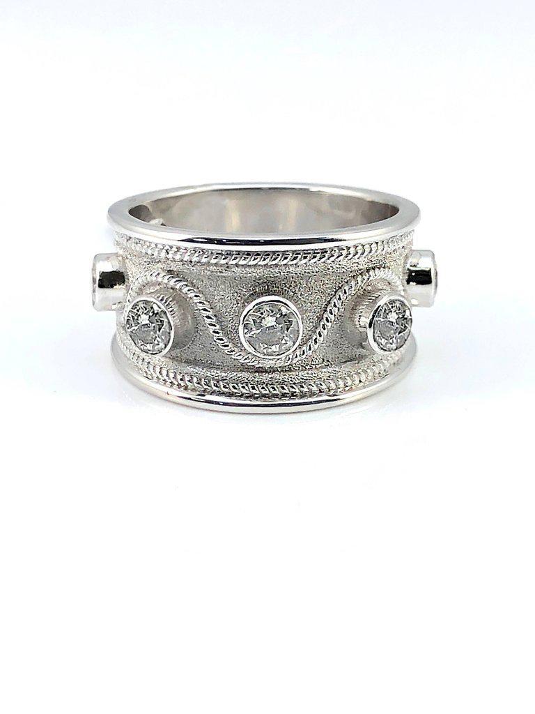 S.Georgios designer 18 Karat White Gold Ring is all handmade with Byzantine workmanship and the unique velvet look on the background. The beautiful ring has granulation work all the way around and features 5 white Brilliant cut Diamonds total weight