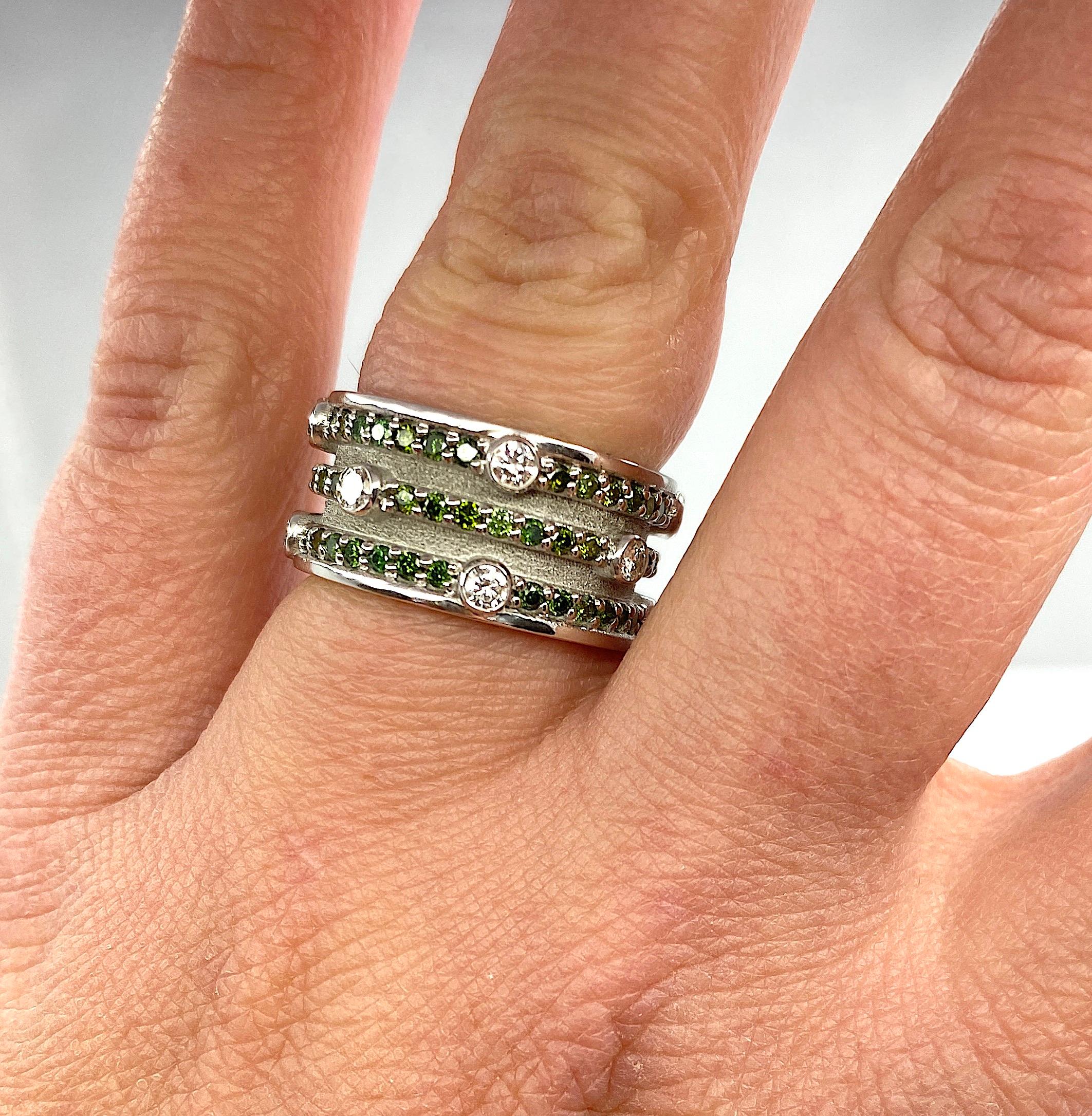This is an S.Georgios designer 18 Karat Solid White Gold Wide Band Ring all handmade in Greece in an elegant look inspired by the Byzantine era. This ring is heavily decorated with diamonds and would make a gorgeous wedding band. The ring features