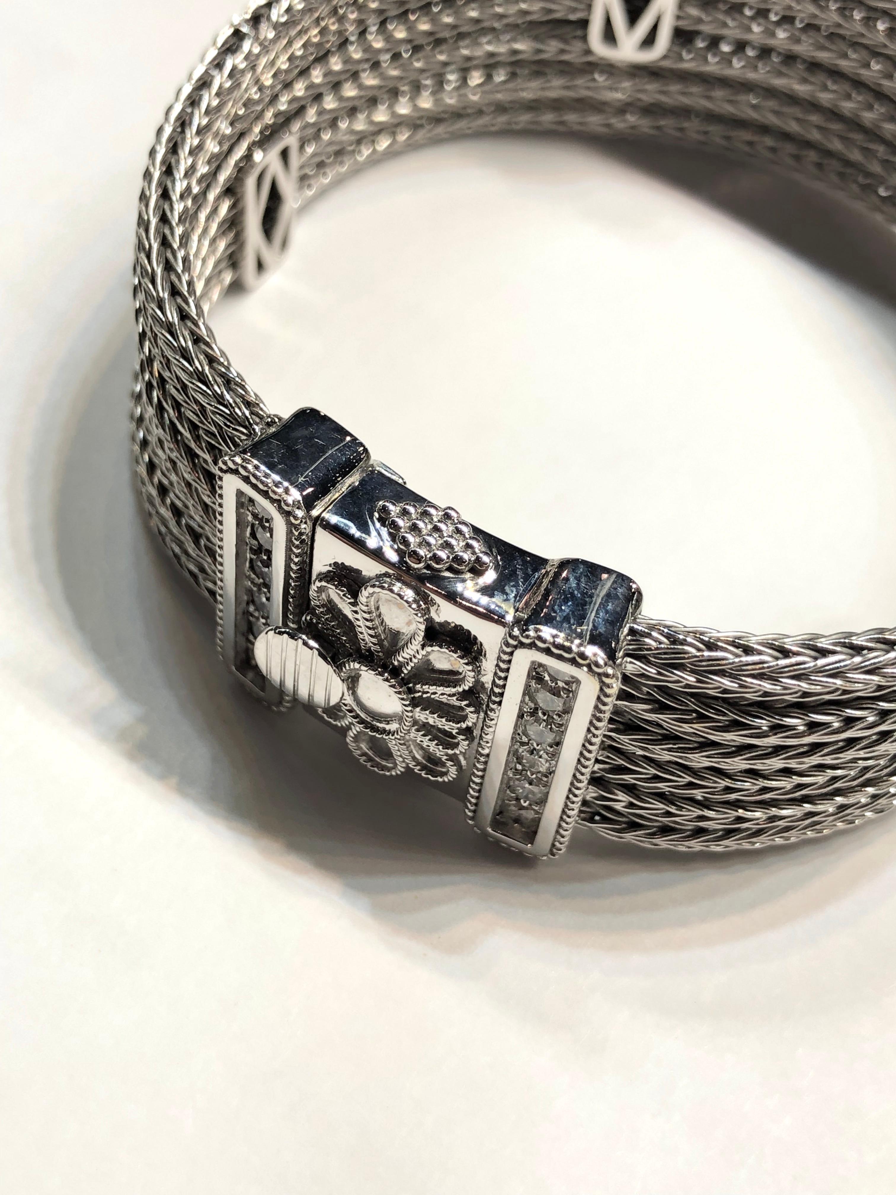 S.Georgios designer handmade bracelet from 18 Karat white gold knitted in our workshop in Greece. This flexible bracelet is made from white gold threads knitted to ropes and decorated with 1.05 Carat Brilliant Cut White Diamonds and Byzantine