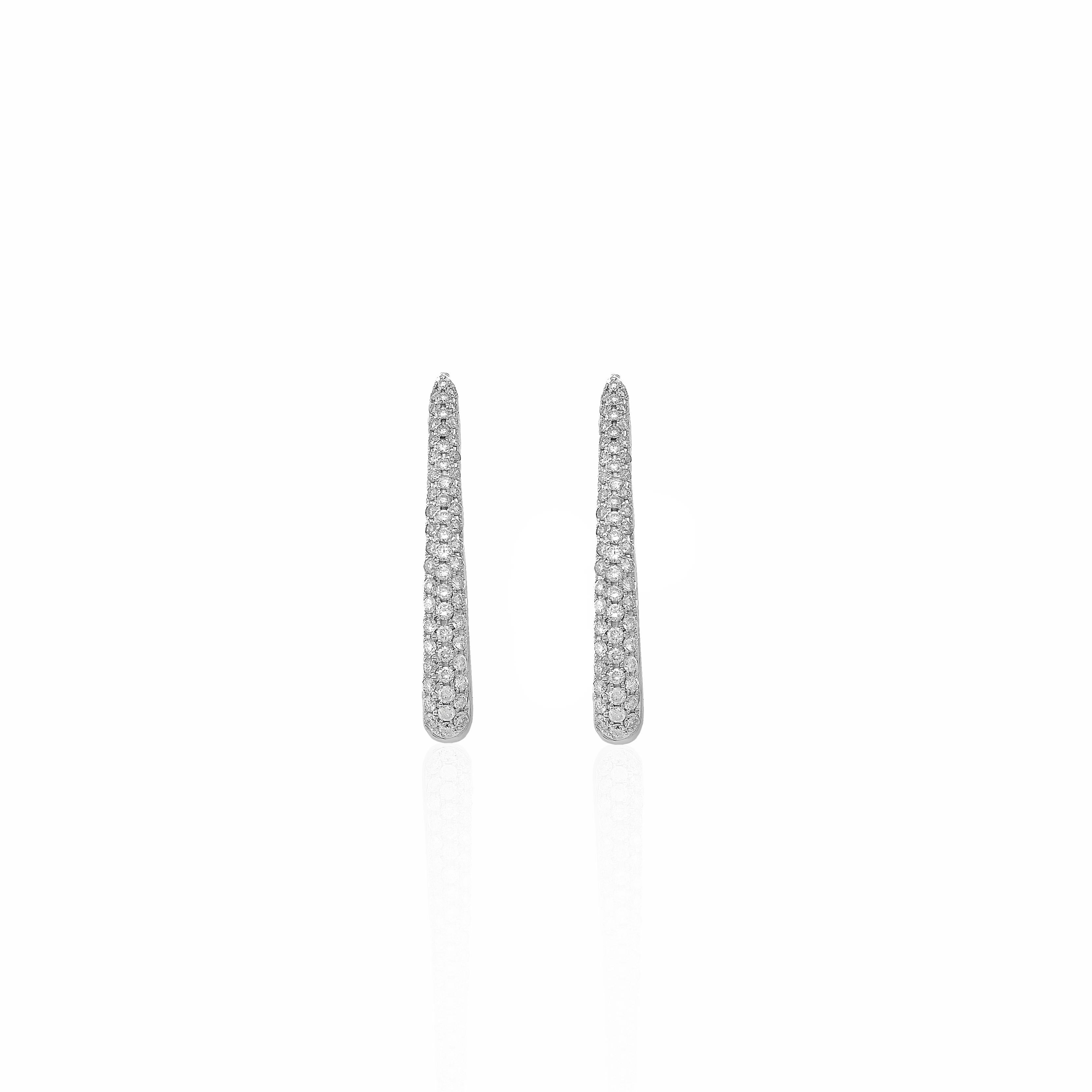 These exquisite 18 Karat Gold Hoop Earrings from Georgios Collections are a sophisticated blend of elegance and modernity. Featuring a long oval design, they are adorned with a total of 1.25 carats of brilliant-cut diamonds that sparkle with every
