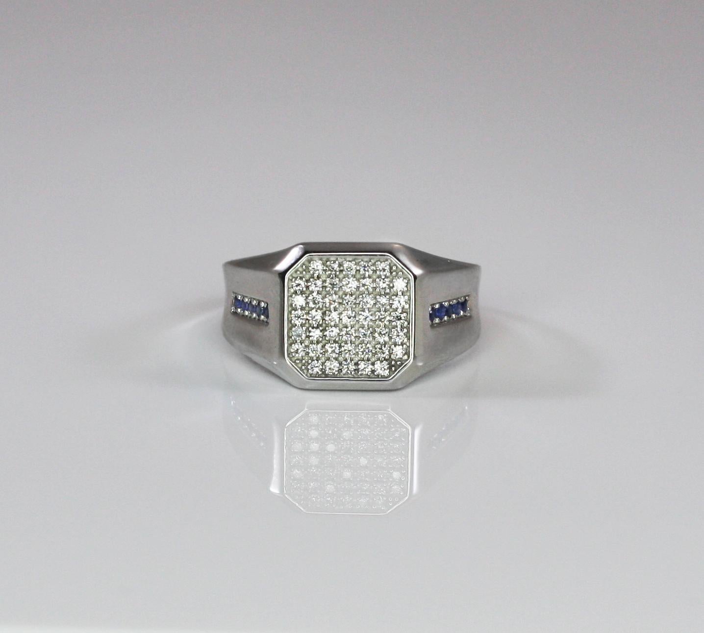 This S.Georgios designer Unisex Men's Band Ring is all hand-made in 18 Karat White Gold and features an elegant octagon made of 45 stunning brilliant cut natural white Diamonds VVS2 color G total weight of 0.45 Carat. On the two sides of this