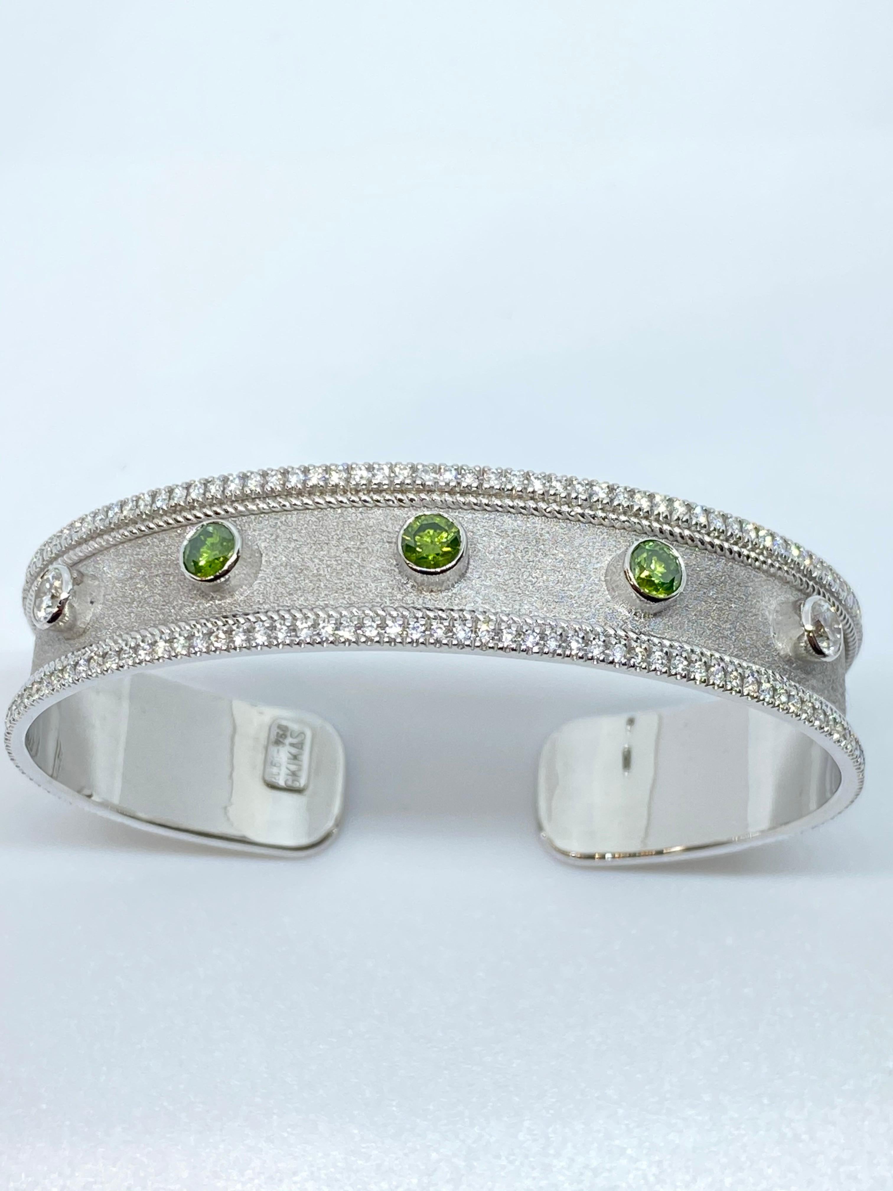 S.Georgios designer multicolor diamond cuff bracelet all handmade from solid 18 Karat White Gold and microscopically decorated with white gold granulation and a unique Byzantine velvet background. This gorgeous Bracelet features in the center 3