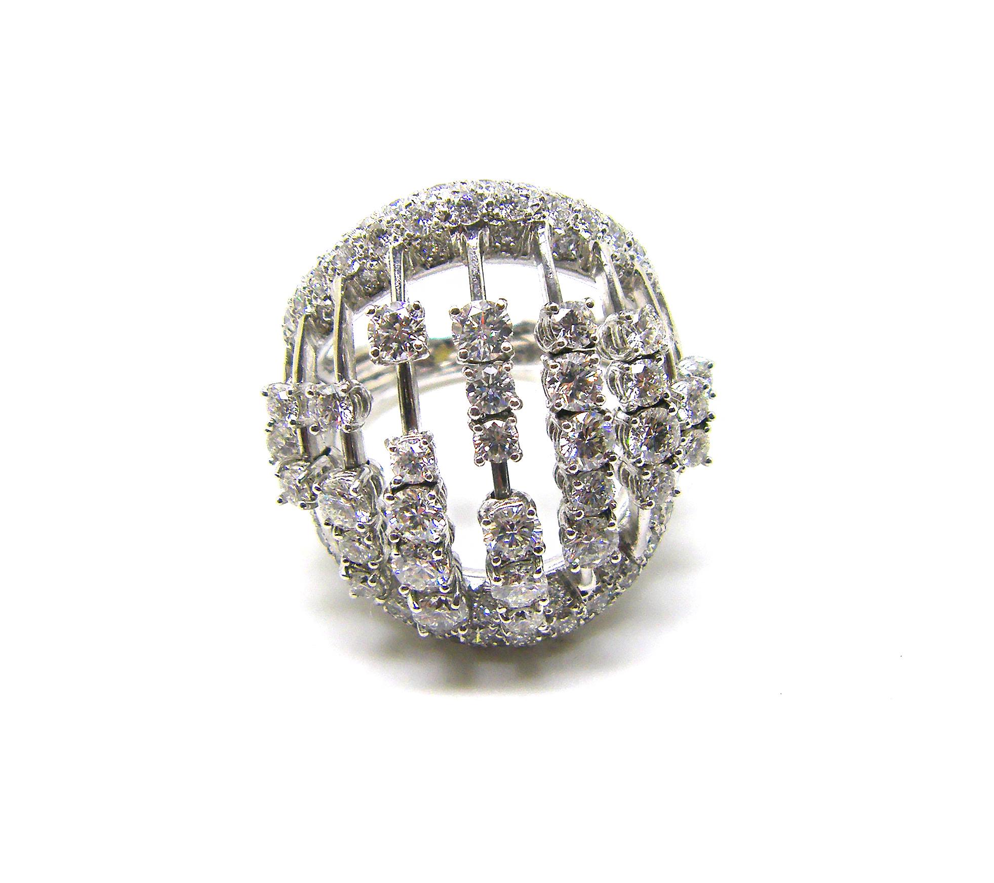 S.Georgios designer 18 Karat White Gold Brilliant Cut Diamond Wide Dome Ring is all handmade in unique many rows of loose diamonds design. The gorgeous ring features 9 (nine) rows of big brilliant cut white diamonds that move with a total weight of