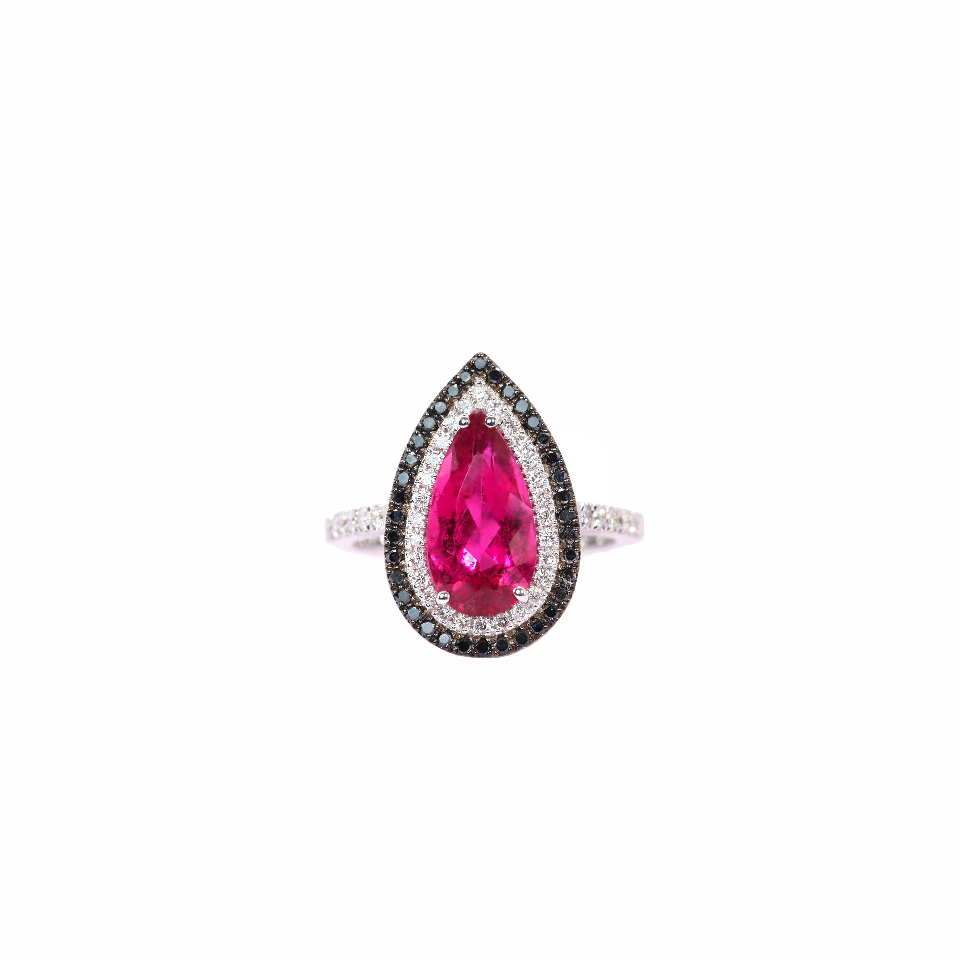 S.Georgios designer ring is handcrafted from solid 18 Karat White Gold, showcasing a stunning pear-shaped Rubelite at its center, weighing 2.90 carats. The vibrant Rubelite is elegantly framed by a halo of brilliant-cut White Diamonds, totaling 0.36