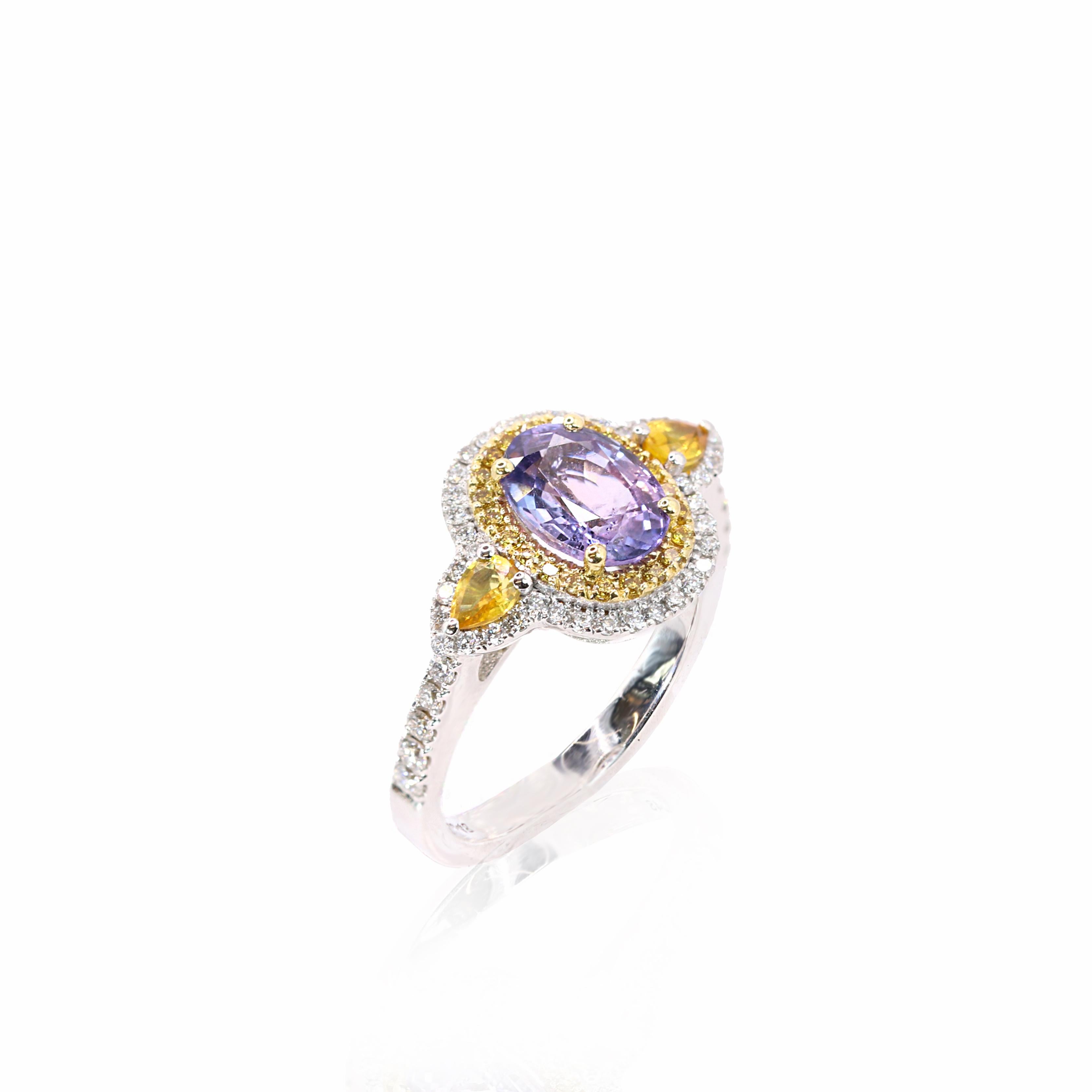 S.Georgios designer presents an exquisite 18K White Gold Ring featuring an oval-cut 2.12 Carats Purple Sapphire at its center. This stunning gemstone is elegantly surrounded by a halo of yellow diamonds total weight of 0.16 carats, followed by a