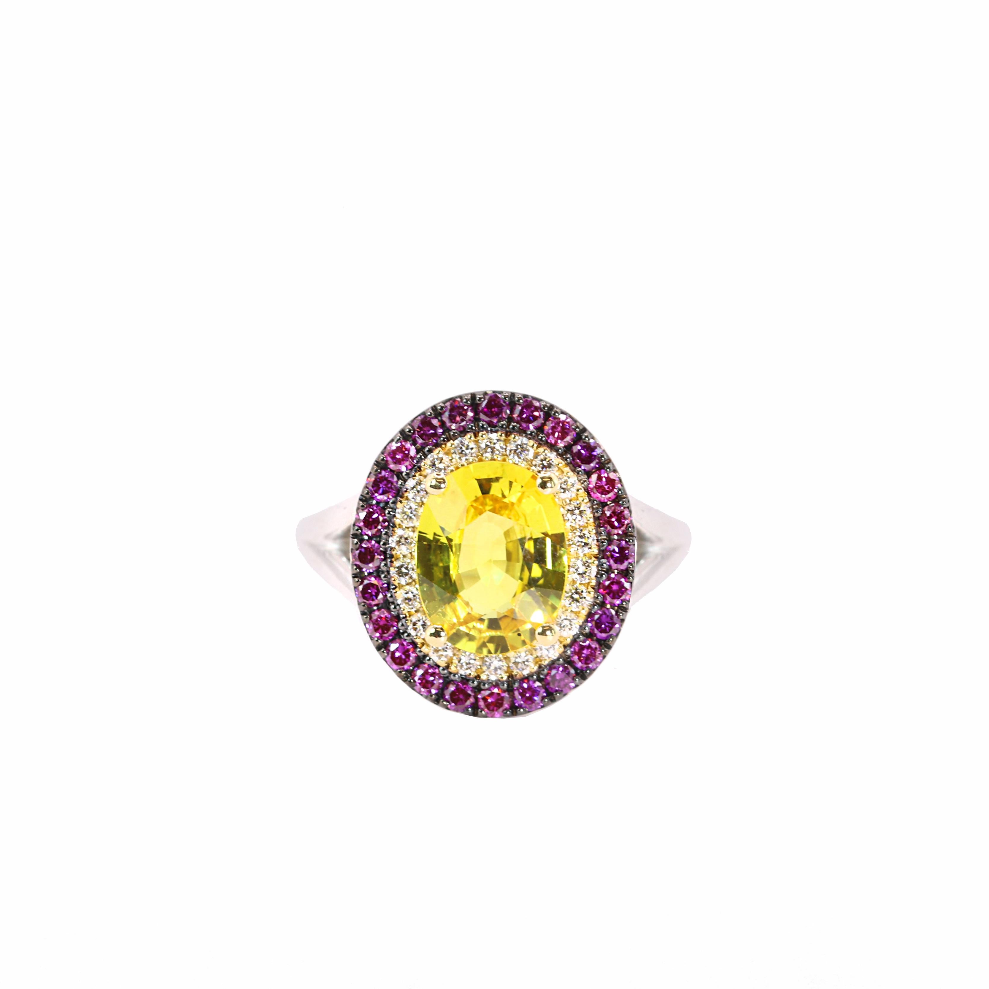 S.Georgios designer presents an exquisite 18K White Gold Ring featuring an oval-cut 2,10 Carats Yellow Sapphire at its center. This vibrant gemstone is elegantly surrounded by a halo of brilliant white diamonds, total weight of 0.18 carats, followed